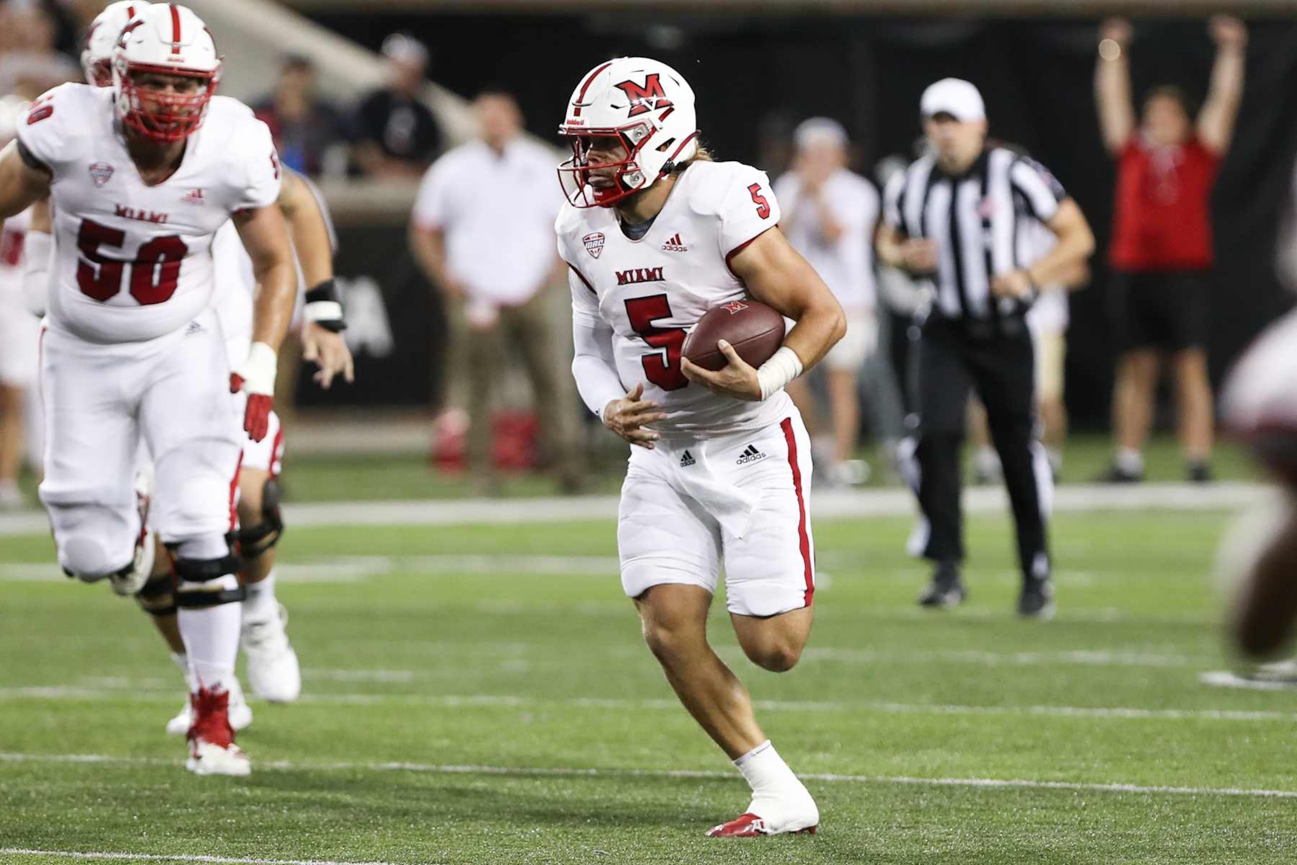 CINCINNATI, OH - SEPTEMBER 16: Miami (Oh) Redhawks quarterback Brett Gabbert (5) carries the ball during the game against the Miami Redhawks and the Cincinnati Bearcats on September 16, 2023, at Nippert Stadium in Cincinnati, OH. (Photo by Ian Johnson/Icon Sportswire via Getty Images CINCINNATI, OH - SEPTEMBER 16: Miami (Oh) Redhawks quarterback Brett Gabbert (5) carries the ball during the game against the Miami Redhawks and the Cincinnati Bearcats on September 16, 2023, at Nippert Stadium in Cincinnati, OH. (Photo by Ian Johnson/Icon Sportswire via Getty Images