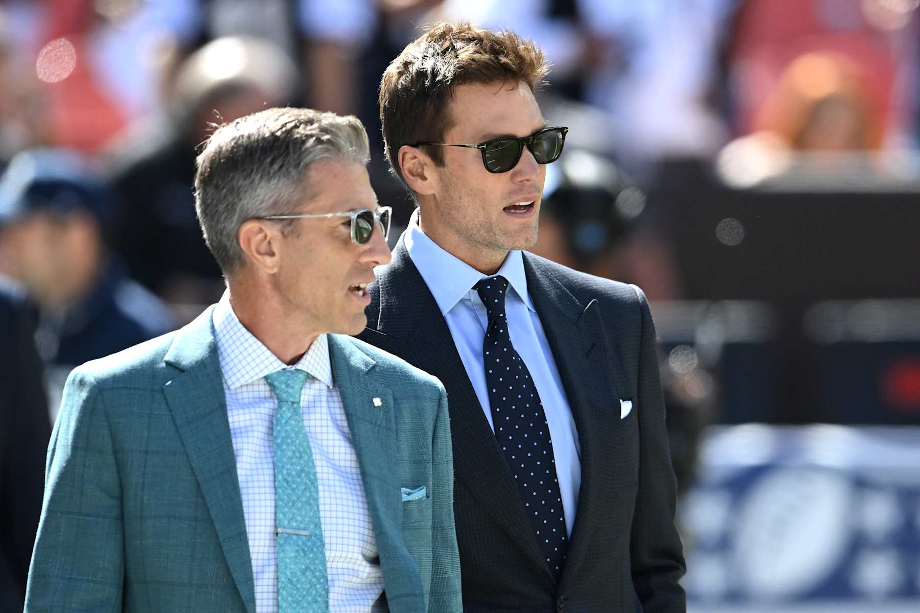 CLEVELAND, OHIO - SEPTEMBER 08: Broadcasters Kevin Burkhardt (L) and Tom Brady (R) walk along the field before the game between the Dallas Cowboys and Cleveland Browns at Cleveland Browns Stadium on September 08, 2024 in Cleveland, Ohio. (Photo by Nick Cammett/Getty Images)