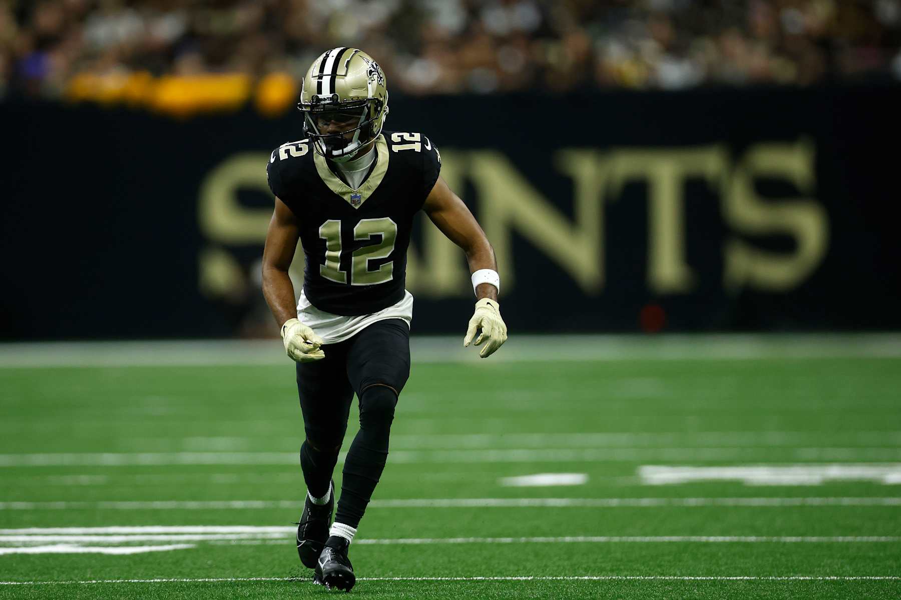 NEW ORLEANS, LOUISIANA - SEPTEMBER 08: Chris Olave #12 of the New Orleans Saints in action against the Carolina Panthers at Caesars Superdome on September 08, 2024 in New Orleans, Louisiana. (Photo by Chris Graythen/Getty Images)