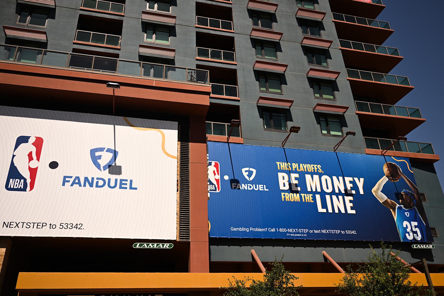 NBA and FanDuel online sports betting signage is displayed on the side of a building in Phoenix, Arizona, on June 5, 2024. (Photo by Patrick T. Fallon / AFP) (Photo by PATRICK T. FALLON/AFP via Getty Images)
