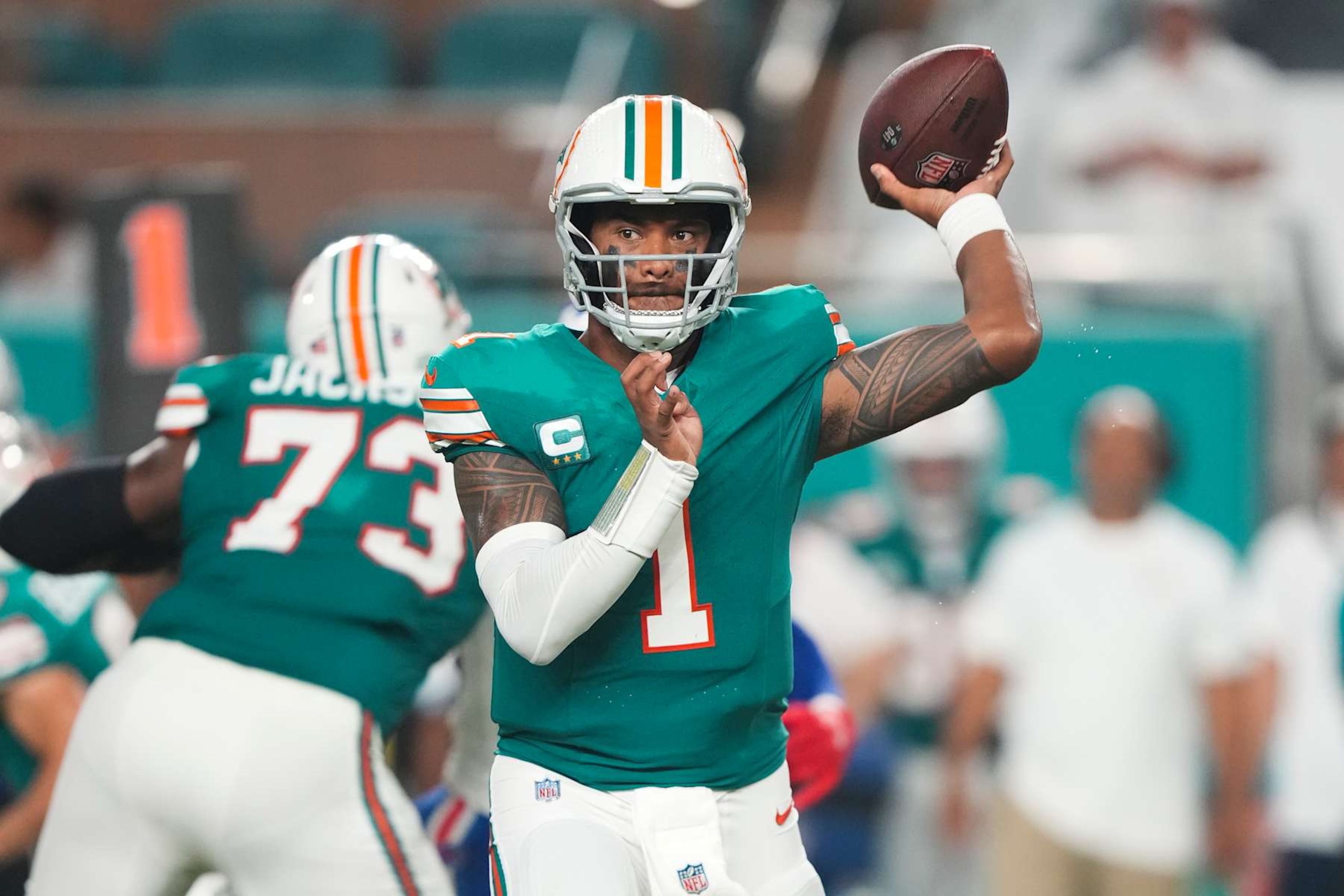 MIAMI GARDENS, FL - SEPTEMBER 12: Miami Dolphins quarterback Tua Tagovailoa (1) makes a pass attempt during the game between the Buffalo Bills and the Miami Dolphins on Thursday, September 12, 2024 at Hard Rock Stadium in Miami Gardens, Fla. (Photo by Peter Joneleit/Icon Sportswire via Getty Images)