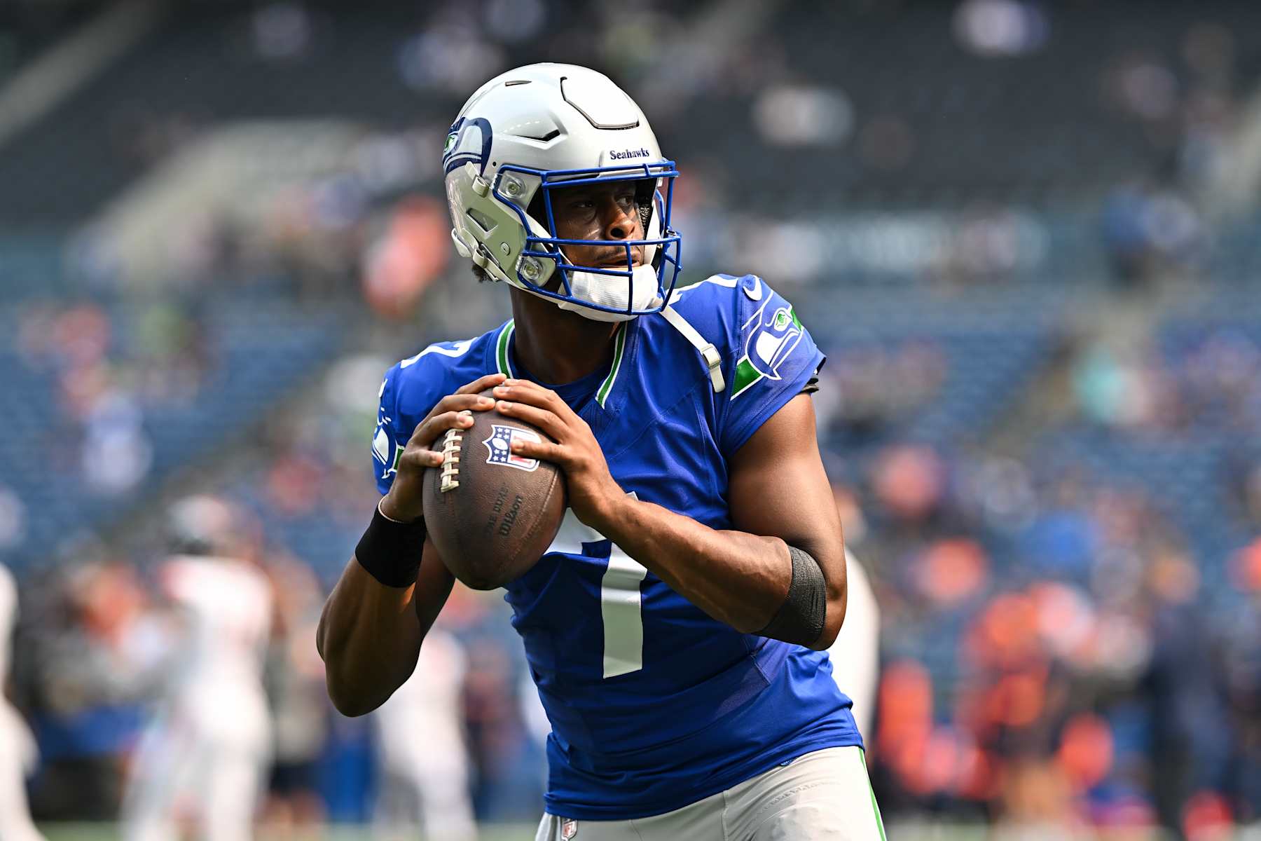 SEATTLE, WASHINGTON - SEPTEMBER 08: Geno Smith #7 of the Seattle Seahawks warms up before the game against the Denver Broncos at Lumen Field on September 08, 2024 in Seattle, Washington. The Seahawks defeated the Broncos 26-20. (Photo by Alika Jenner/Getty Images)