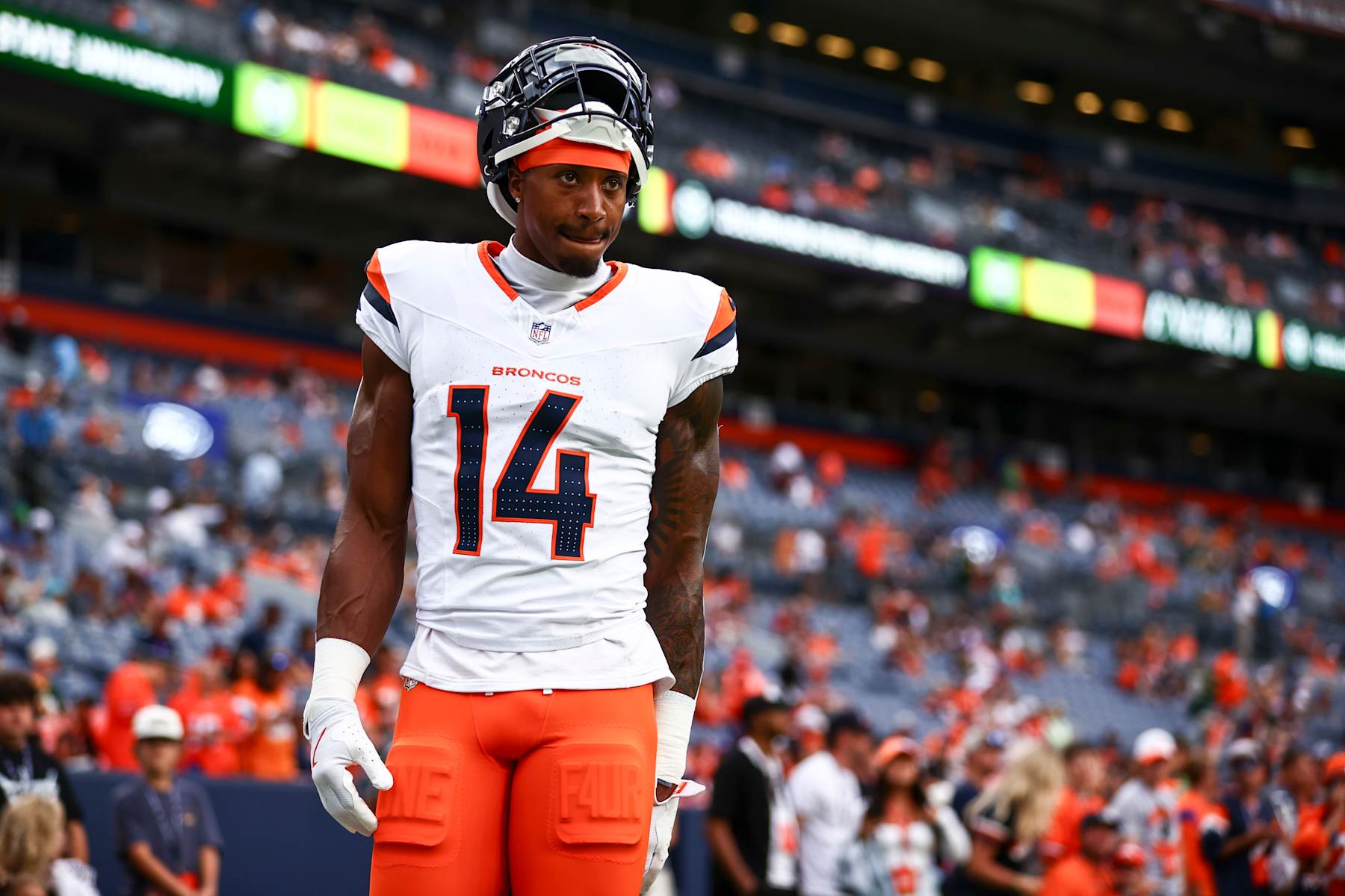 DENVER, COLORADO - AUGUST 18: Courtland Sutton #14 of the Denver Broncos looks on during warmups the preseason game against the Green Bay Packers at Empower Field At Mile High on August 18, 2024 in Denver, Colorado. (Photo by Tyler Schank/Getty Images)