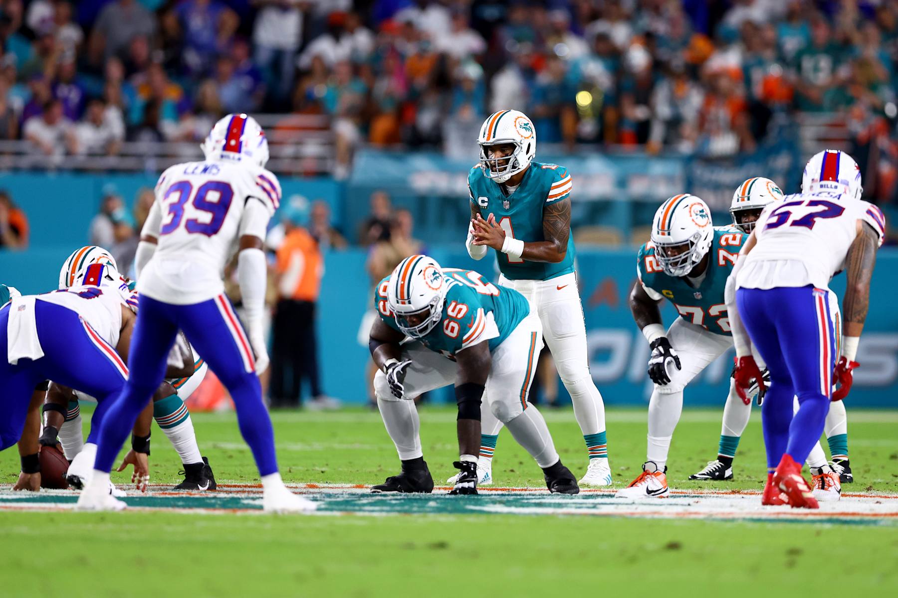 MIAMI GARDENS, FLORIDA - SEPTEMBER 12: Tua Tagovailoa #1 of the Miami Dolphins hikes the ball against the Buffalo Bills during the first quarter in the game at Hard Rock Stadium on September 12, 2024 in Miami Gardens, Florida. (Photo by Megan Briggs/Getty Images)