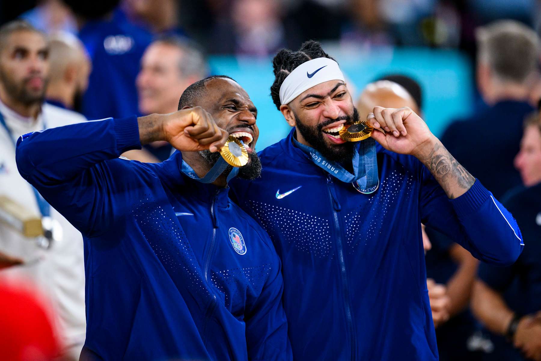 PARIS, FRANCE - AUGUST 11: Gold medalist LeBron James of Team United States and Anthony Davis of Team United States celebrate after the Men's basketball medal ceremony on day fifteen of the Olympic Games Paris 2024 at the Bercy Arena on August 11, 2024 in Paris, France. (Photo by Tom Weller/VOIGT/GettyImages)