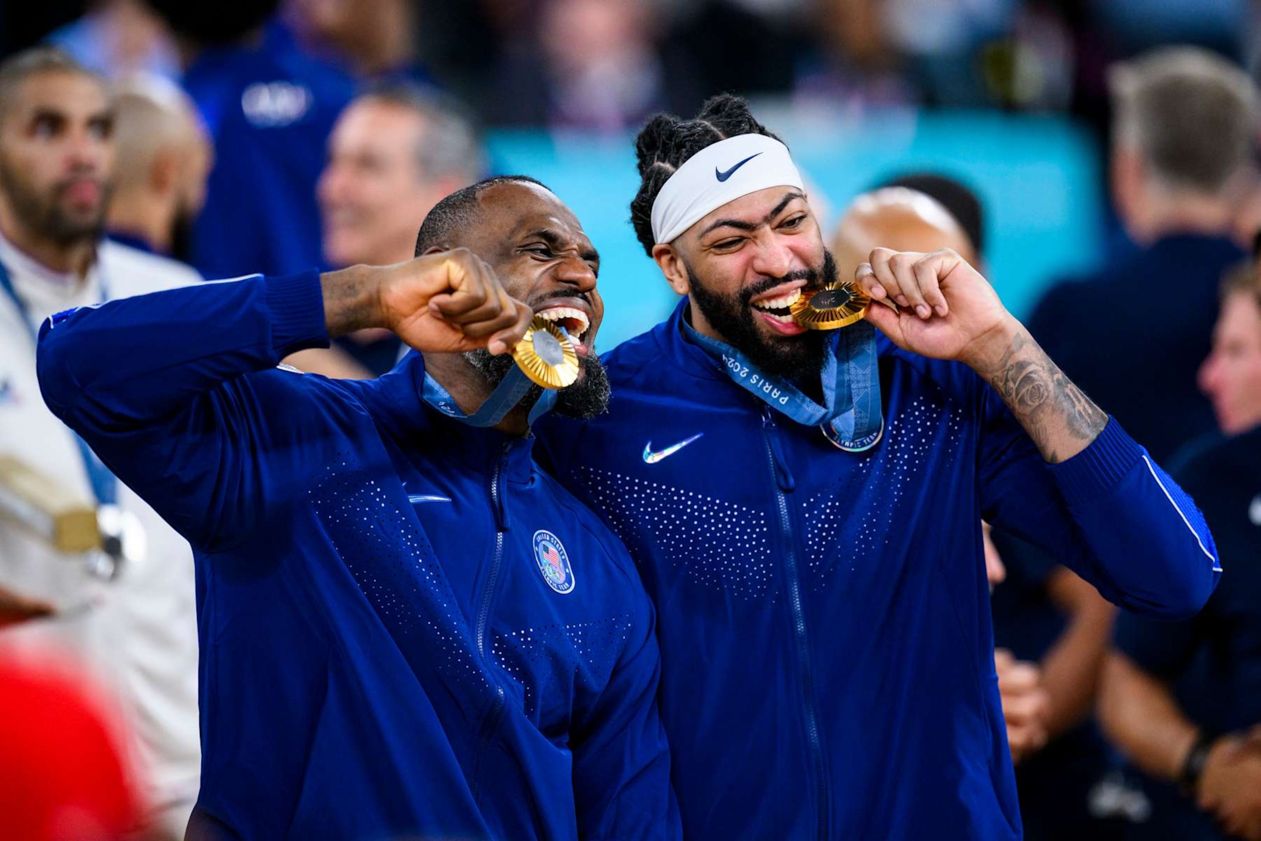 PARIS, FRANCE - AUGUST 11: Gold medalist LeBron James of Team United States and Anthony Davis of Team United States celebrate after the Men's basketball medal ceremony on day fifteen of the Olympic Games Paris 2024 at the Bercy Arena on August 11, 2024 in Paris, France. (Photo by Tom Weller/VOIGT/GettyImages)