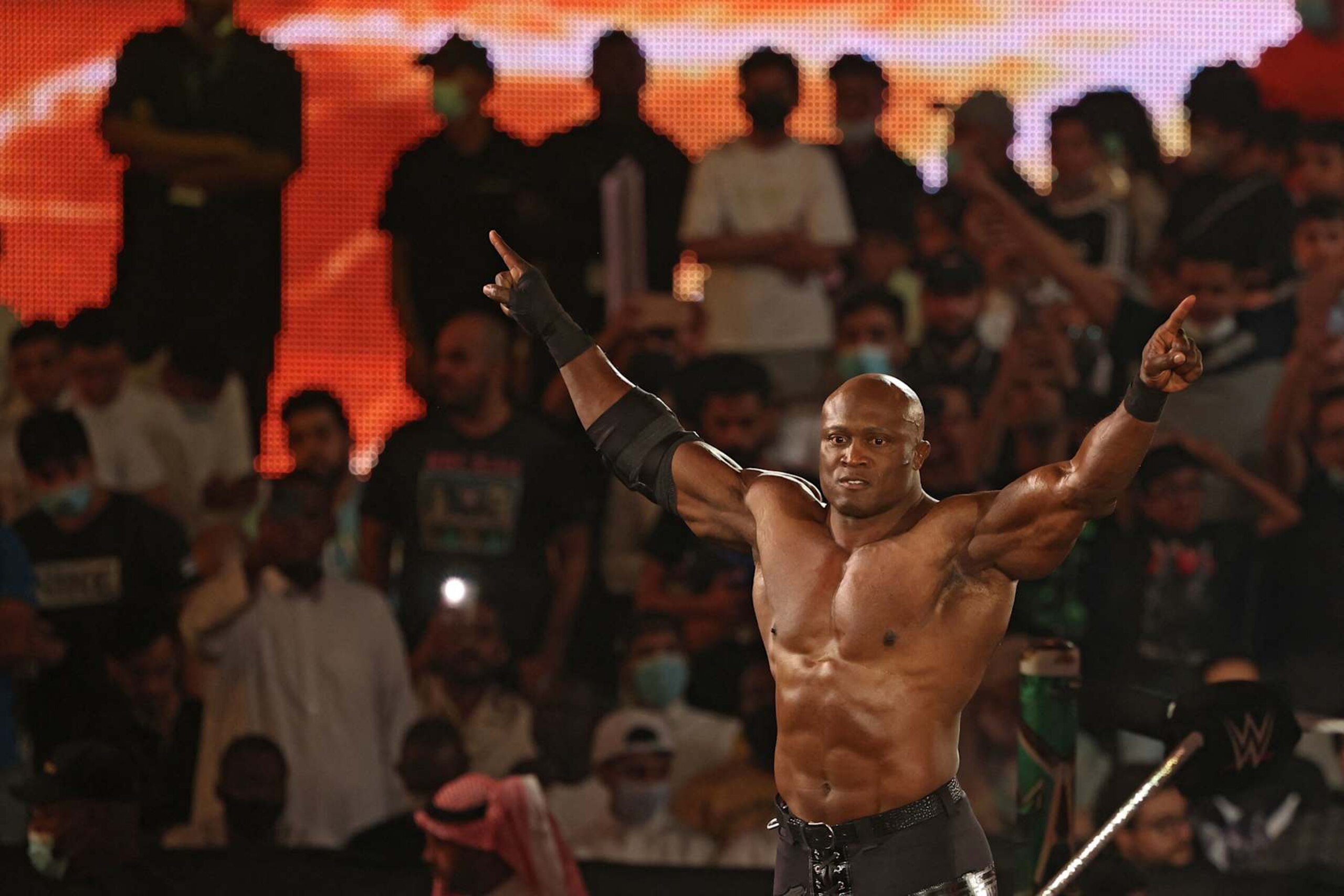 Bobby Lashley greets the crowd ahead of his match during the World Wrestling Entertainment (WWE) Crown Jewel pay-per-view in the Saudi capital Riyadh on October 21, 2021. (Photo by Fayez Nureldine / AFP) (Photo by FAYEZ NURELDINE/AFP via Getty Images) Bobby Lashley greets the crowd ahead of his match during the World Wrestling Entertainment (WWE) Crown Jewel pay-per-view in the Saudi capital Riyadh on October 21, 2021. (Photo by Fayez Nureldine / AFP) (Photo by FAYEZ NURELDINE/AFP via Getty Images)