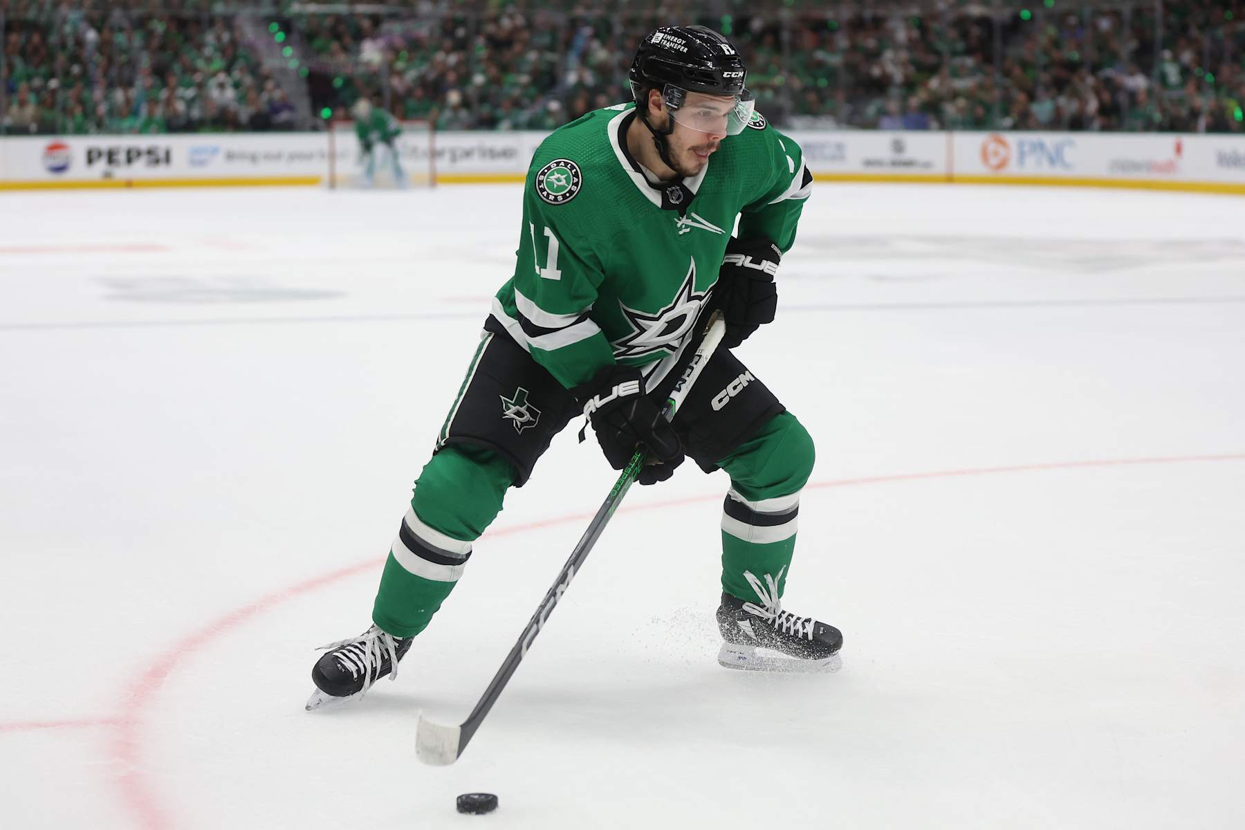 DALLAS, TEXAS - MAY 31: Logan Stankoven #11 of the Dallas Stars looks for an opening against the Edmonton Oilers in the first period during Game Five of the Western Conference Final of the 2024 Stanley Cup Playoffs at American Airlines Center on May 31, 2024 in Dallas, Texas. (Photo by Matthew Stockman/Getty Images)