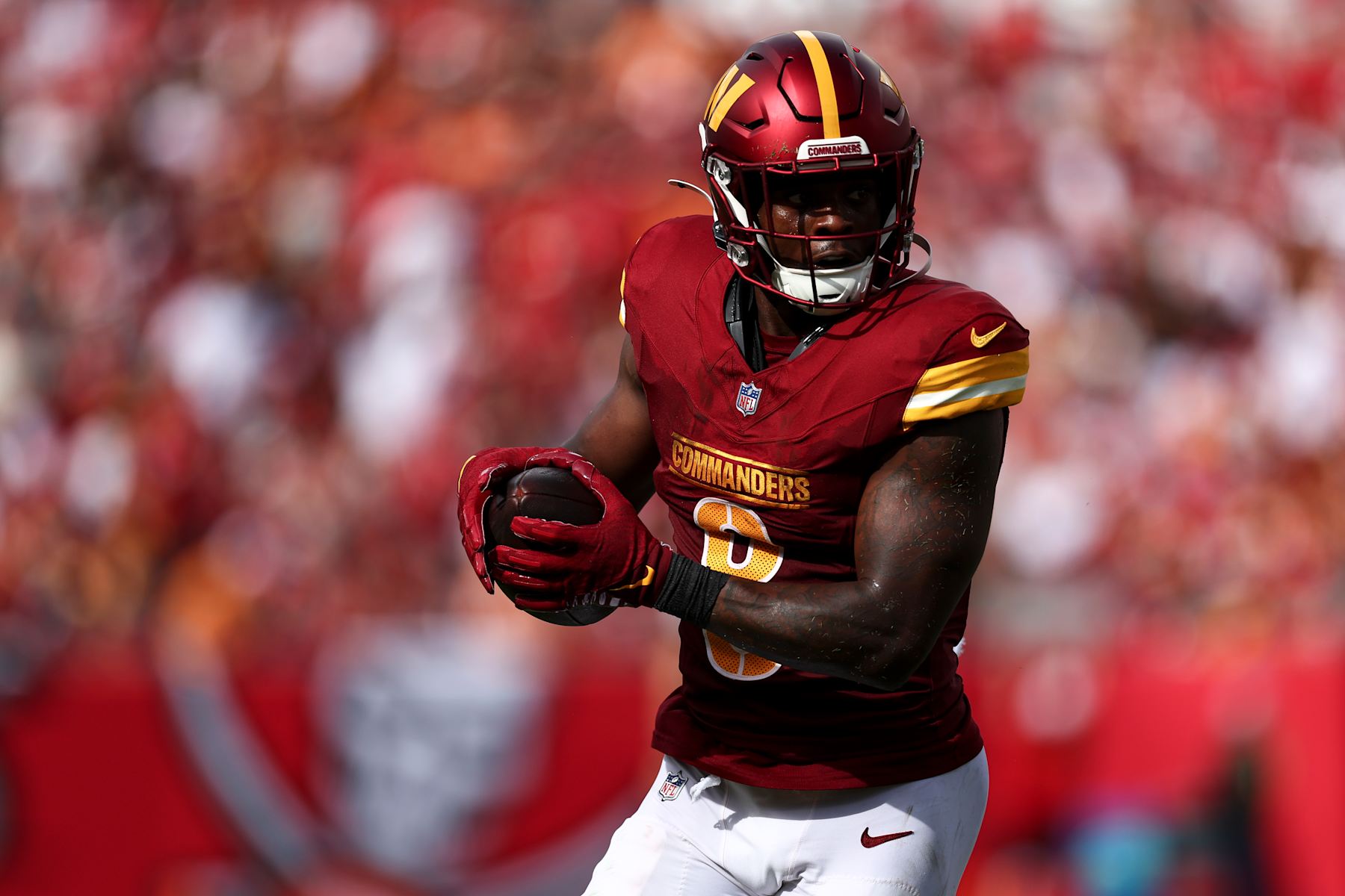TAMPA, FL - SEPTEMBER 8: Brian Robinson Jr. #8 of the Washington Commanders carries the ball during the first quarter of an NFL football game against the Tampa Bay Buccaneers at Raymond James Stadium on September 8, 2024 in Tampa, Florida. (Photo by Kevin Sabitus/Getty Images)