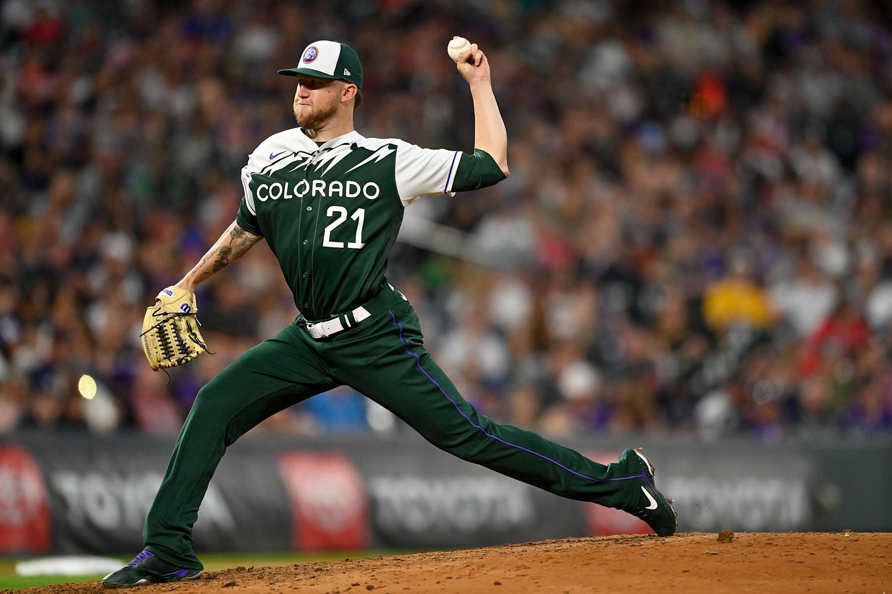 DENVER, CO - JUNE 4: Kyle Freeland #21 of the Colorado Rockies pitches against the Atlanta Braves at Coors Field on June 4, 2022 in Denver, Colorado. The Colorado Rockies debuted the team's city connect uniforms in the game. (Photo by Dustin Bradford/Getty Images)