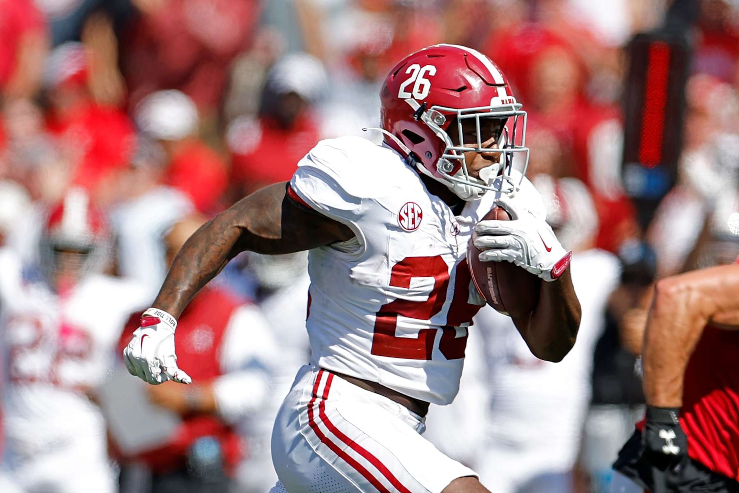 MADISON, WISCONSIN - SEPTEMBER 14: Jam Miller #26 of the Alabama Crimson Tide runs for a 34 yard touchdown run in the third quarter against the Wisconsin Badgers at Camp Randall Stadium on September 14, 2024 in Madison, Wisconsin. (Photo by John Fisher/Getty Images)