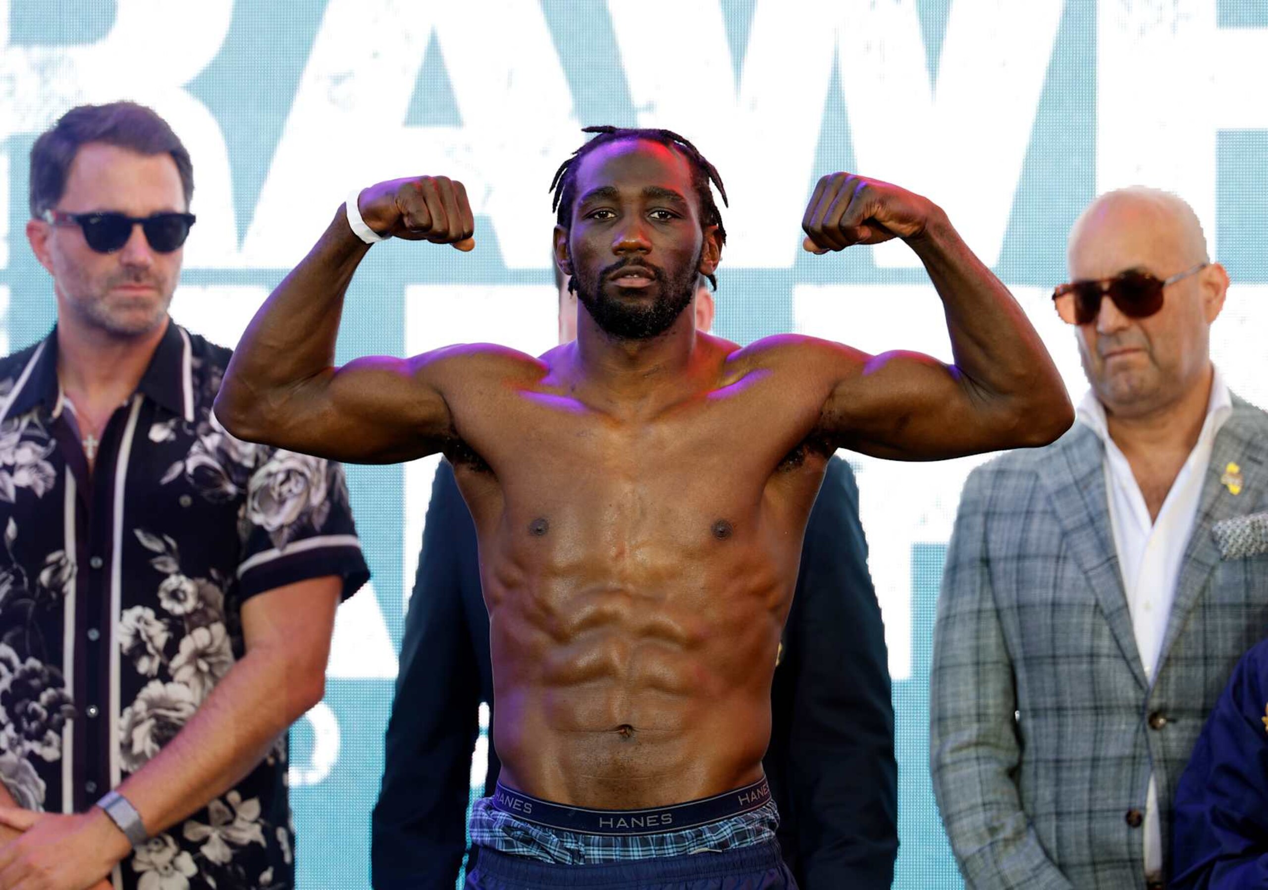 LOS ANGELES, CALIFORNIA - AUGUST 2: Terence Crawford (L), a welterweight undisputed champion, poses on the scale after his official weigh-in at LA Live on August 2, 2024 in Los Angeles, California. Crawford and Madrimov will fight for the super-welterweight title on Saturday August 3, 2024 at BMO Stadium in Los Angeles, California. (Photo by Kevork Djansezian/Getty Images) LOS ANGELES, CALIFORNIA - AUGUST 2: Terence Crawford (L), a welterweight undisputed champion, poses on the scale after his official weigh-in at LA Live on August 2, 2024 in Los Angeles, California. Crawford and Madrimov will fight for the super-welterweight title on Saturday August 3, 2024 at BMO Stadium in Los Angeles, California. (Photo by Kevork Djansezian/Getty Images)