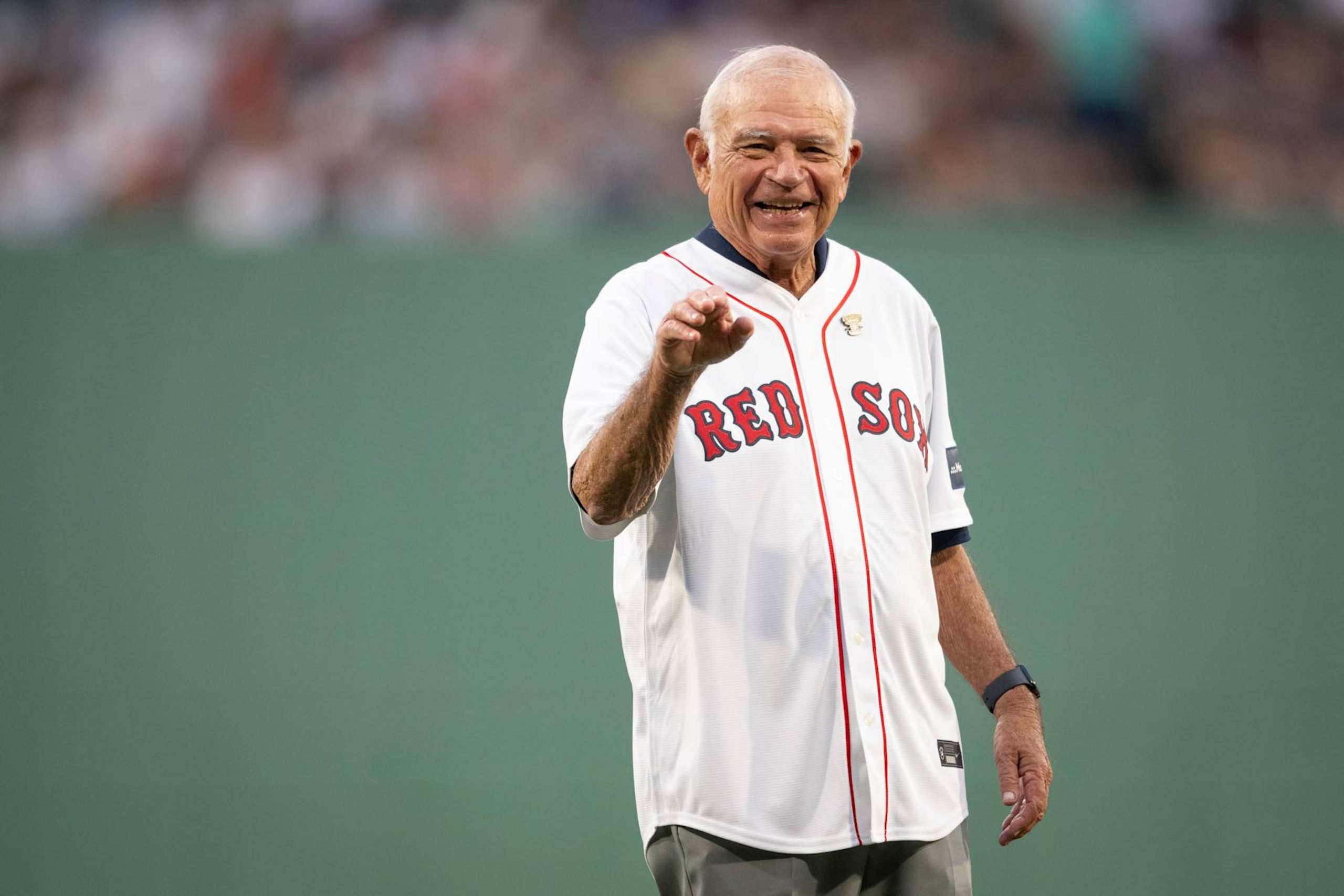 BOSTON, MA - JULY 28: Broadcaster Joe Castiglione reacts throws a ceremonial first pitch recognizing his receipt of the National Baseball Hall of Fame 2024 Ford C. Frick Award before a game between the New York Yankees and the Boston Red Sox on July 28, 2024 at Fenway Park in Boston, Massachusetts. (Photo by Maddie Malhotra/Boston Red Sox/Getty Images)