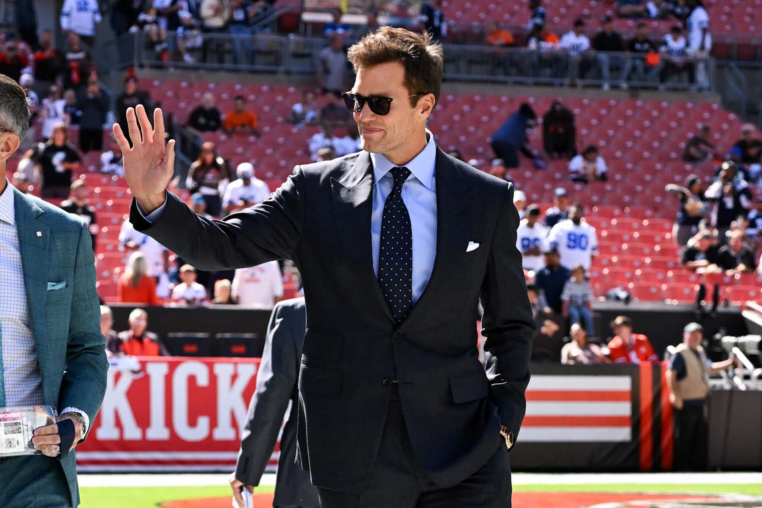 CLEVELAND, OHIO - SEPTEMBER 08: Fox Sports commentator Tom Brady waves to fans prior to a game between the Dallas Cowboys and the Cleveland Browns at Huntington Bank Field on September 08, 2024 in Cleveland, Ohio. (Photo by Nick Cammett/Diamond Images via Getty Images) CLEVELAND, OHIO - SEPTEMBER 08: Fox Sports commentator Tom Brady waves to fans prior to a game between the Dallas Cowboys and the Cleveland Browns at Huntington Bank Field on September 08, 2024 in Cleveland, Ohio. (Photo by Nick Cammett/Diamond Images via Getty Images)
