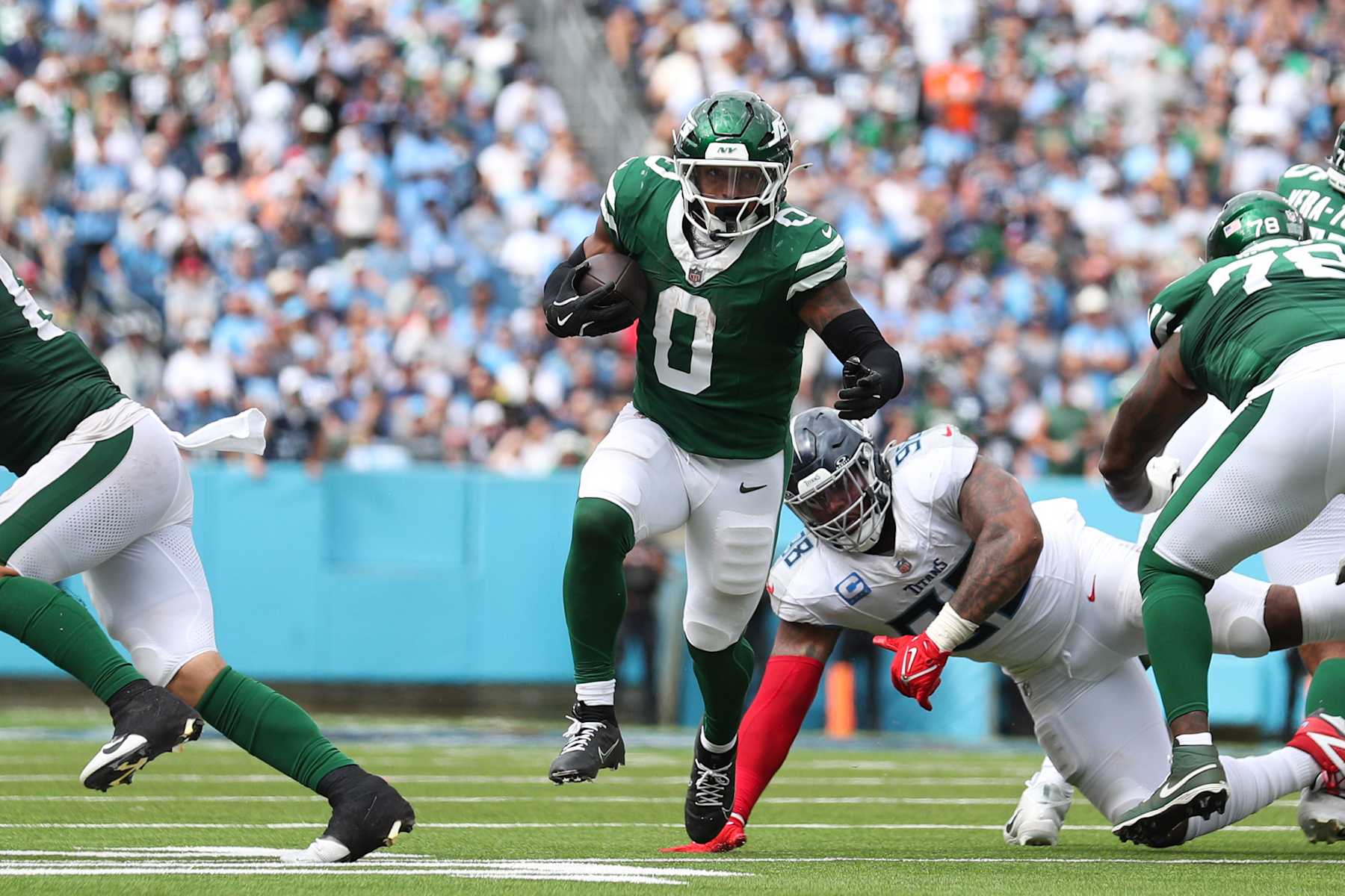 NASHVILLE, TENNESSEE - SEPTEMBER 15: Braelon Allen #0 of the New York Jets runs for a second half touchdown against the Tennessee Titans at Nissan Stadium on September 15, 2024 in Nashville, Tennessee. (Photo by Justin Ford/Getty Images)