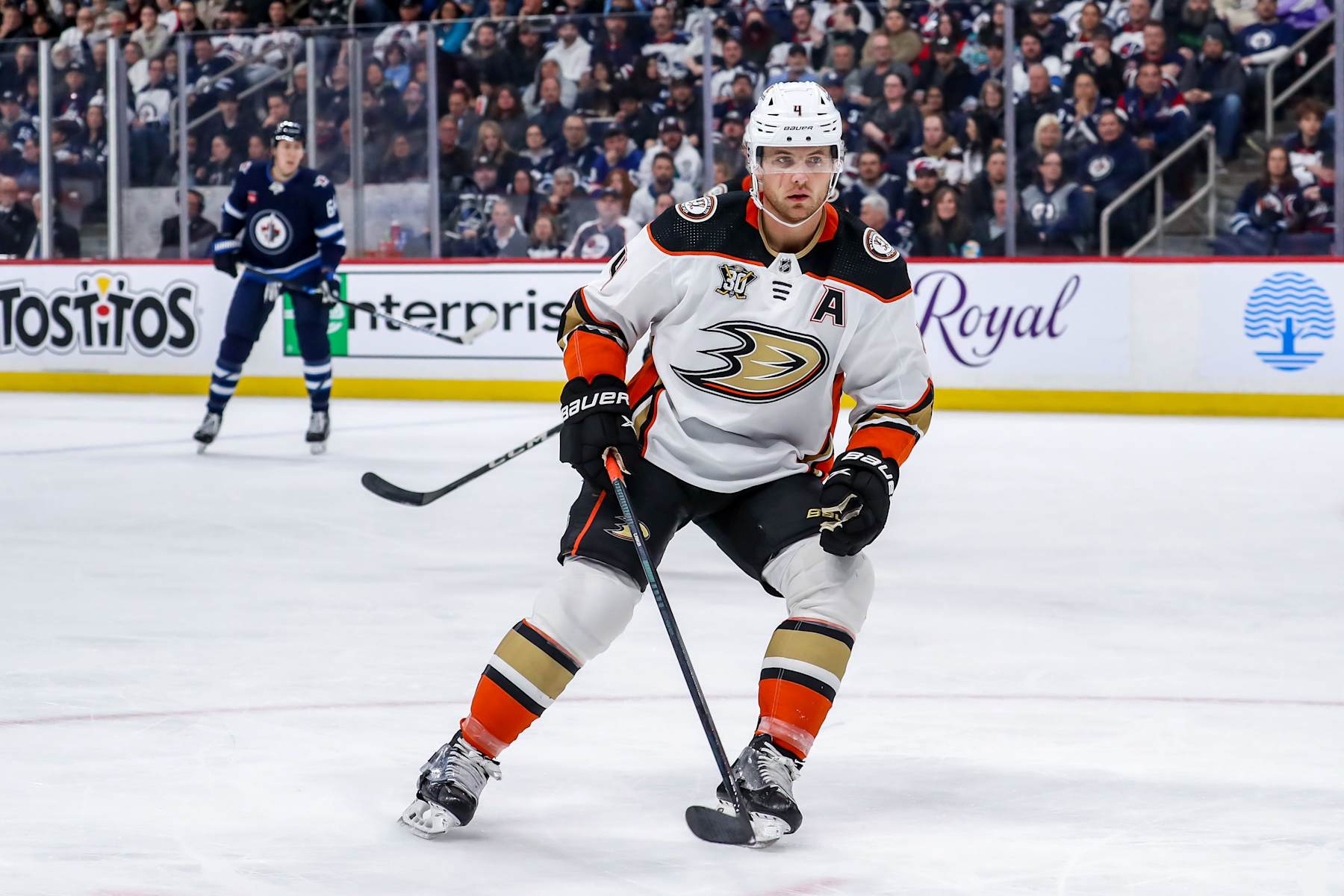 WINNIPEG, CANADA - MARCH 15: Cam Fowler #4 of the Anaheim Ducks keeps an eye on the play during first period action against the Winnipeg Jets at the Canada Life Centre on March 15, 2024 in Winnipeg, Manitoba, Canada. The Jets shutout the Ducks 6-0. (Photo by Darcy Finley/NHLI via Getty Images)
