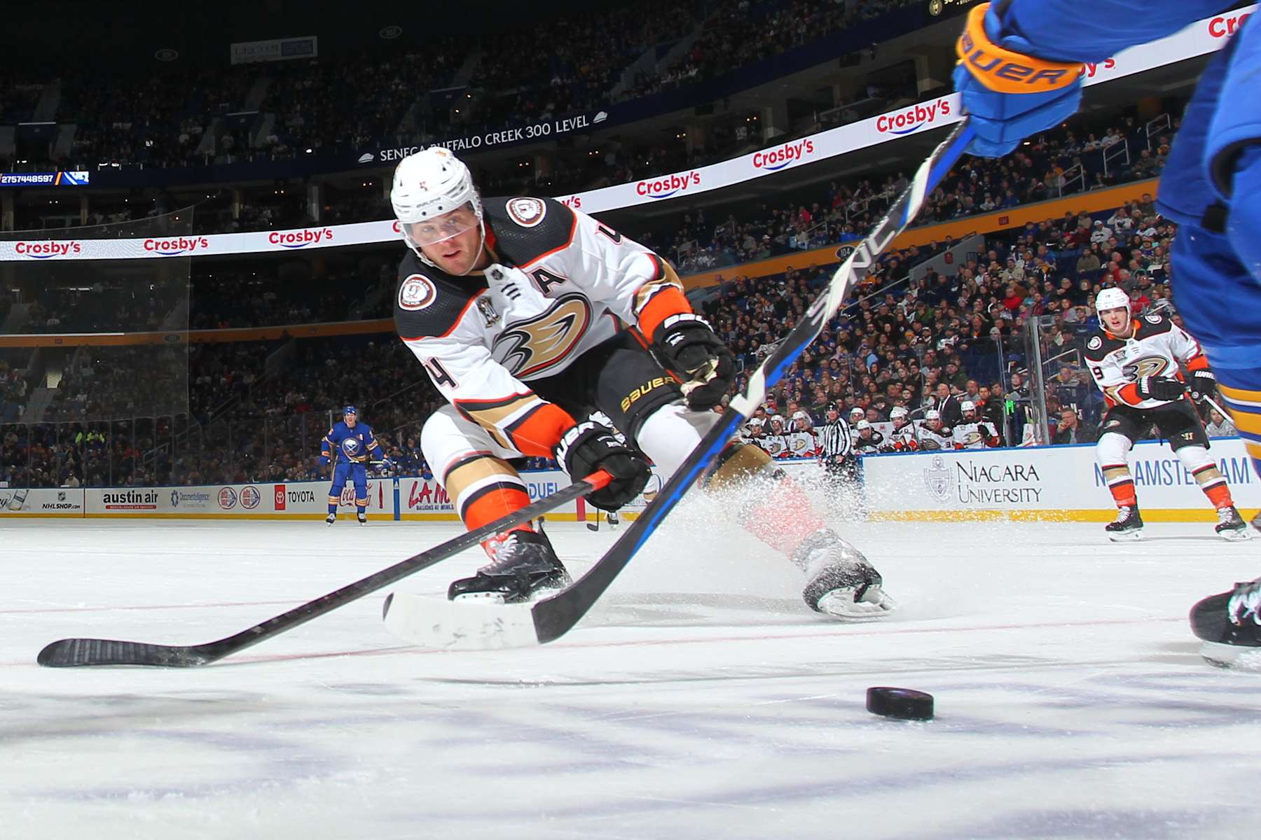 BUFFALO, NEW YORK - FEBRUARY 19: Cam Fowler #4 of the Anaheim Ducks defends against the Buffalo Sabres during an NHL game on February 19, 2024 at KeyBank Center in Buffalo, New York. Anaheim won, 4-3. (Photo by Bill Wippert/NHLI via Getty Images)
