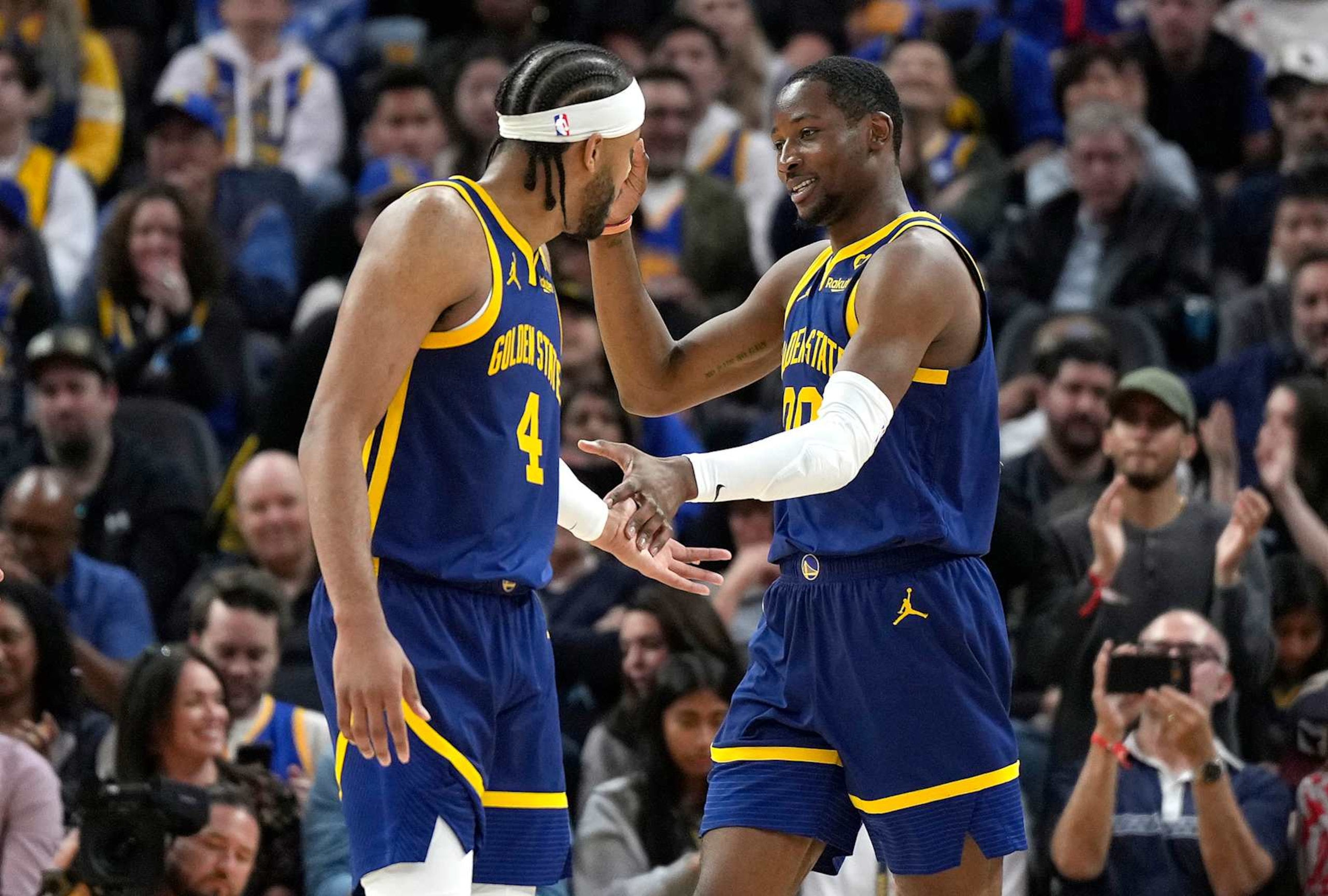 SAN FRANCISCO, CALIFORNIA - APRIL 07: Jonathan Kuminga #00 of the Golden State Warriors is congratulated by Moses Moody #4 after Kuminga scored and was fouled on the shot against the Utah Jazz during second half at Chase Center on April 07, 2024 in San Francisco, California. NOTE TO USER: User expressly acknowledges and agrees that, by downloading and or using this photograph, User is consenting to the terms and conditions of the Getty Images License Agreement. (Photo by Thearon W. Henderson/Getty Images) SAN FRANCISCO, CALIFORNIA - APRIL 07: Jonathan Kuminga #00 of the Golden State Warriors is congratulated by Moses Moody #4 after Kuminga scored and was fouled on the shot against the Utah Jazz during second half at Chase Center on April 07, 2024 in San Francisco, California. NOTE TO USER: User expressly acknowledges and agrees that, by downloading and or using this photograph, User is consenting to the terms and conditions of the Getty Images License Agreement. (Photo by Thearon W. Henderson/Getty Images)