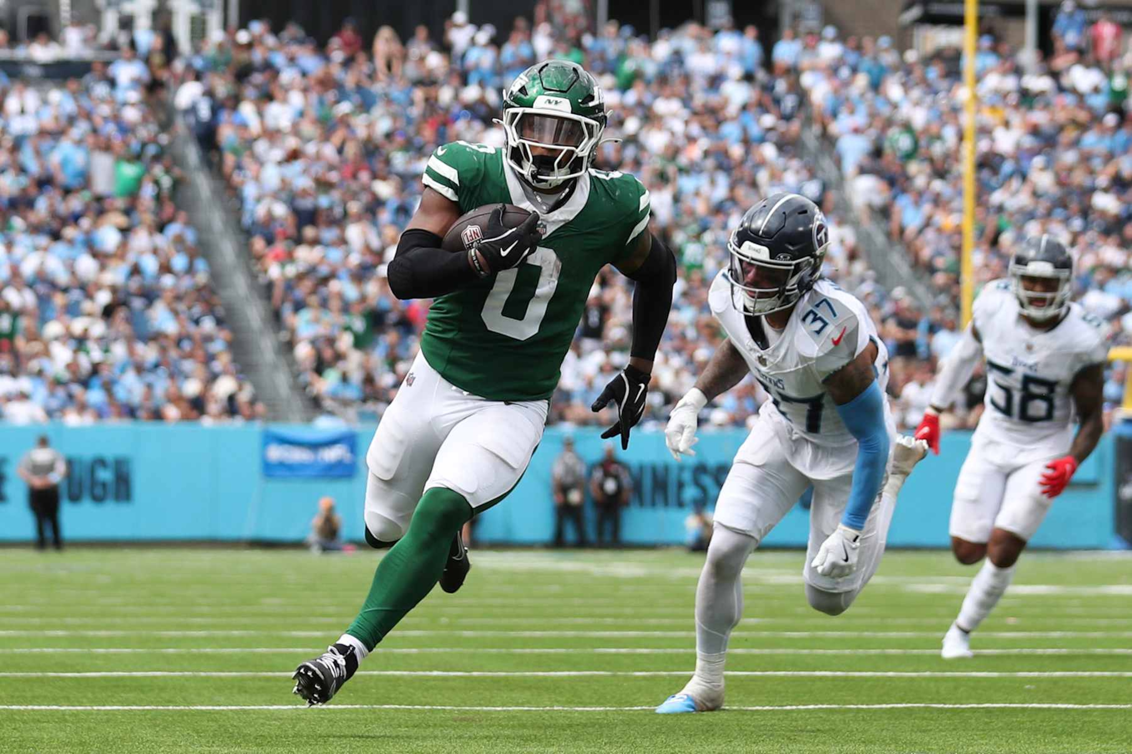 NASHVILLE, TENNESSEE - SEPTEMBER 15: Braelon Allen #0 of the New York Jets scores a second half touchdown against the Tennessee Titans at Nissan Stadium on September 15, 2024 in Nashville, Tennessee. (Photo by Justin Ford/Getty Images)