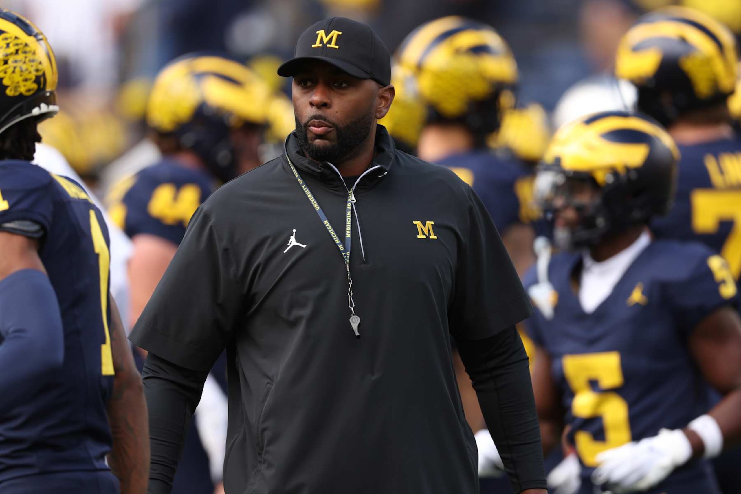 ANN ARBOR, MICHIGAN - SEPTEMBER 07: Head coach Sherrone Moore of the Michigan Wolverines is seen on the field during warmups prior to a game against the Texas Longhorns at Michigan Stadium on September 07, 2024 in Ann Arbor, Michigan. (Photo by Gregory Shamus/Getty Images) ANN ARBOR, MICHIGAN - SEPTEMBER 07: Head coach Sherrone Moore of the Michigan Wolverines is seen on the field during warmups prior to a game against the Texas Longhorns at Michigan Stadium on September 07, 2024 in Ann Arbor, Michigan. (Photo by Gregory Shamus/Getty Images)