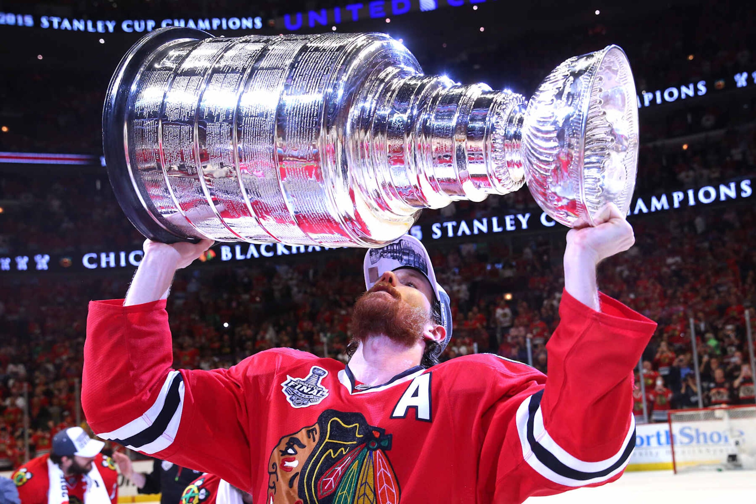 CHICAGO, IL - JUNE 15: Duncan Keith #2 of the Chicago Blackhawks celebrates by hoisting the Stanley Cup after defeating the Tampa Bay Lightning by a score of 2-0 in Game Six to win the 2015 NHL Stanley Cup Final at the United Center on June 15, 2015 in Chicago, Illinois. (Photo by Bruce Bennett/Getty Images) CHICAGO, IL - JUNE 15: Duncan Keith #2 of the Chicago Blackhawks celebrates by hoisting the Stanley Cup after defeating the Tampa Bay Lightning by a score of 2-0 in Game Six to win the 2015 NHL Stanley Cup Final at the United Center on June 15, 2015 in Chicago, Illinois. (Photo by Bruce Bennett/Getty Images)