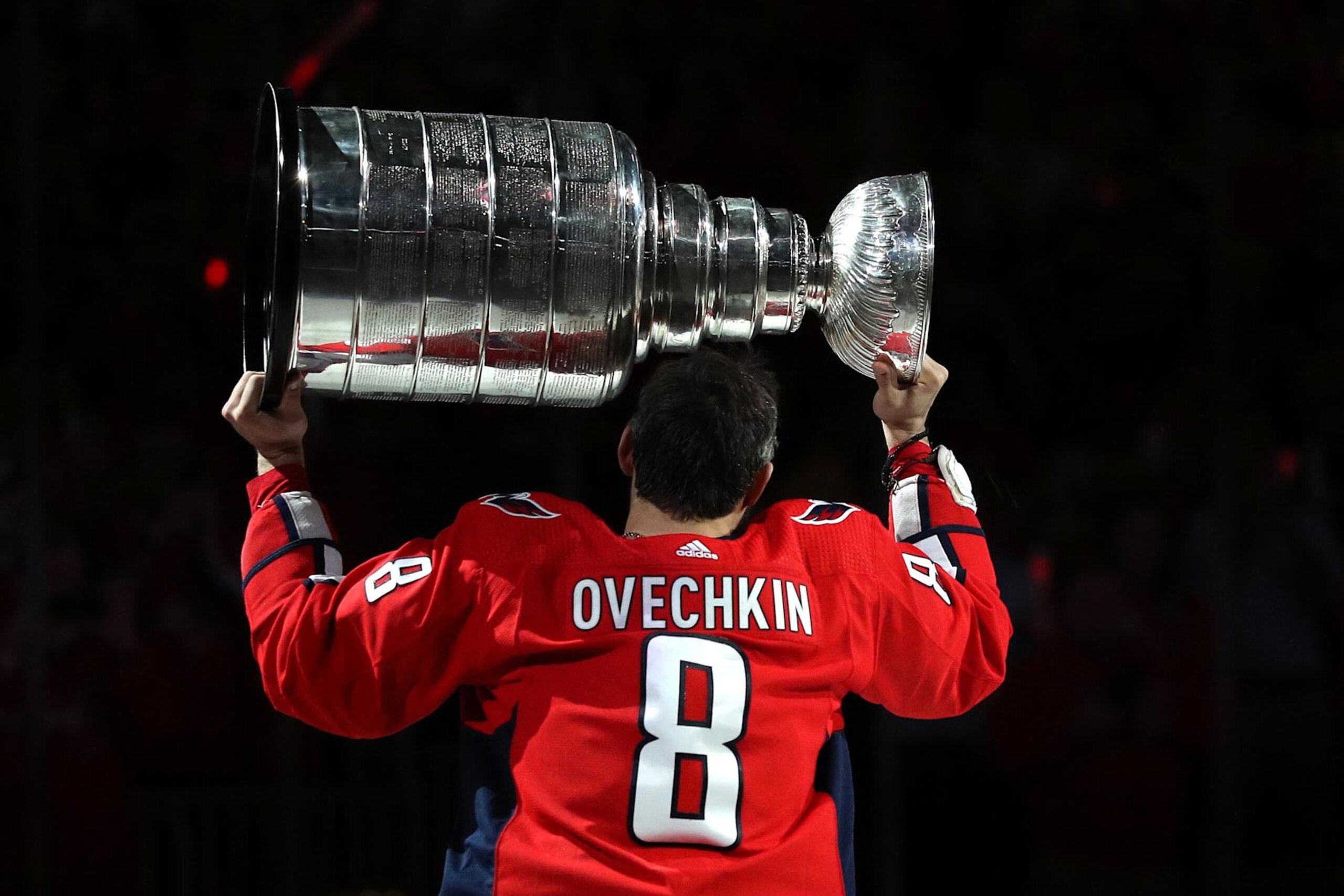 WASHINGTON, DC - OCTOBER 03: Alex Ovechkin #8 of the Washington Capitals skates with the Stanley Cup prior to watching the 2018 Stanley Cup Championship banner rise to the rafters before playing against the Boston Bruins at Capital One Arena on October 3, 2018 in Washington, DC. (Photo by Patrick Smith/Getty Images) WASHINGTON, DC - OCTOBER 03: Alex Ovechkin #8 of the Washington Capitals skates with the Stanley Cup prior to watching the 2018 Stanley Cup Championship banner rise to the rafters before playing against the Boston Bruins at Capital One Arena on October 3, 2018 in Washington, DC. (Photo by Patrick Smith/Getty Images)