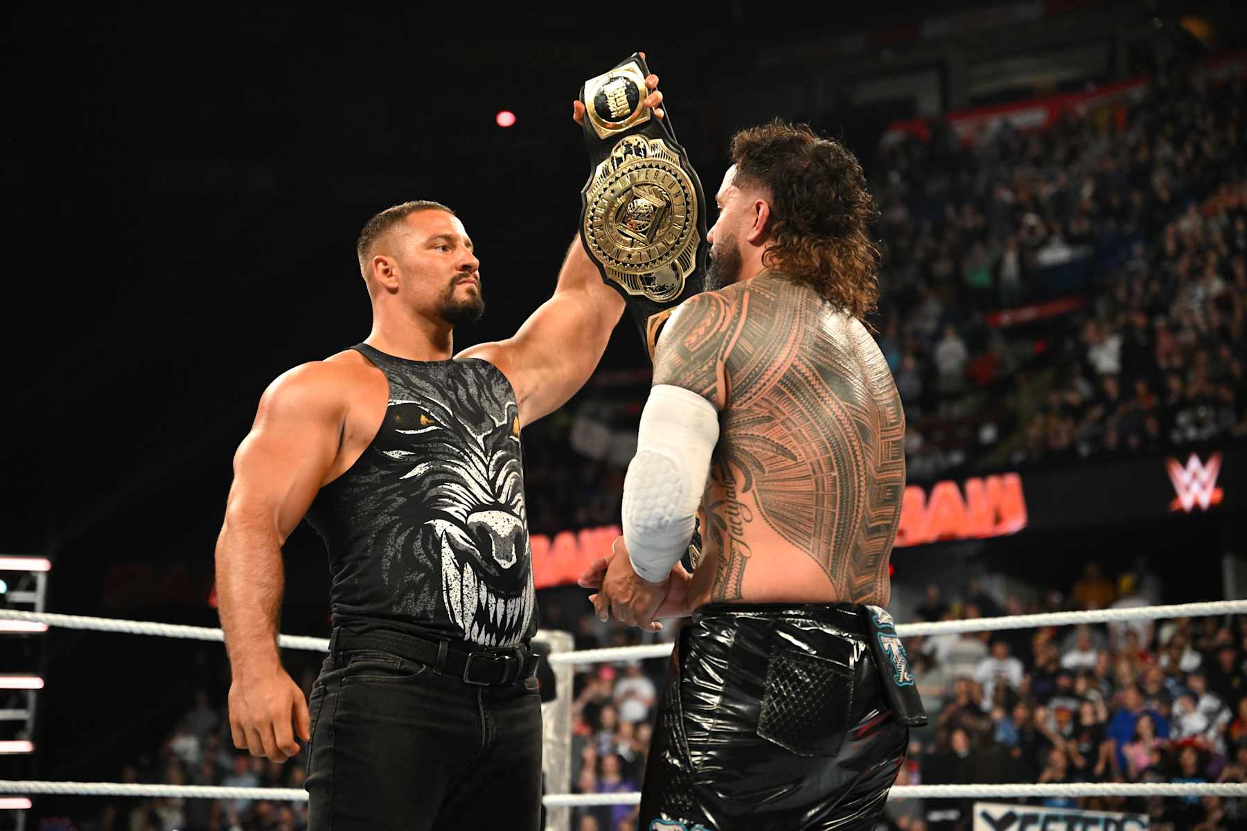CALGARY, CANADA - SEPTEMBER 9: WWE Intercontinental Champion Bron Breakker (L) faces off with Jey Uso after Uso won his fatal-4-way match to become the #1 contender for the Intercontinental title during Monday Night RAW at the Scotiabank Saddledome on September 9, 2024 in Calgary, Canada.  (Photo by WWE/Getty Images)