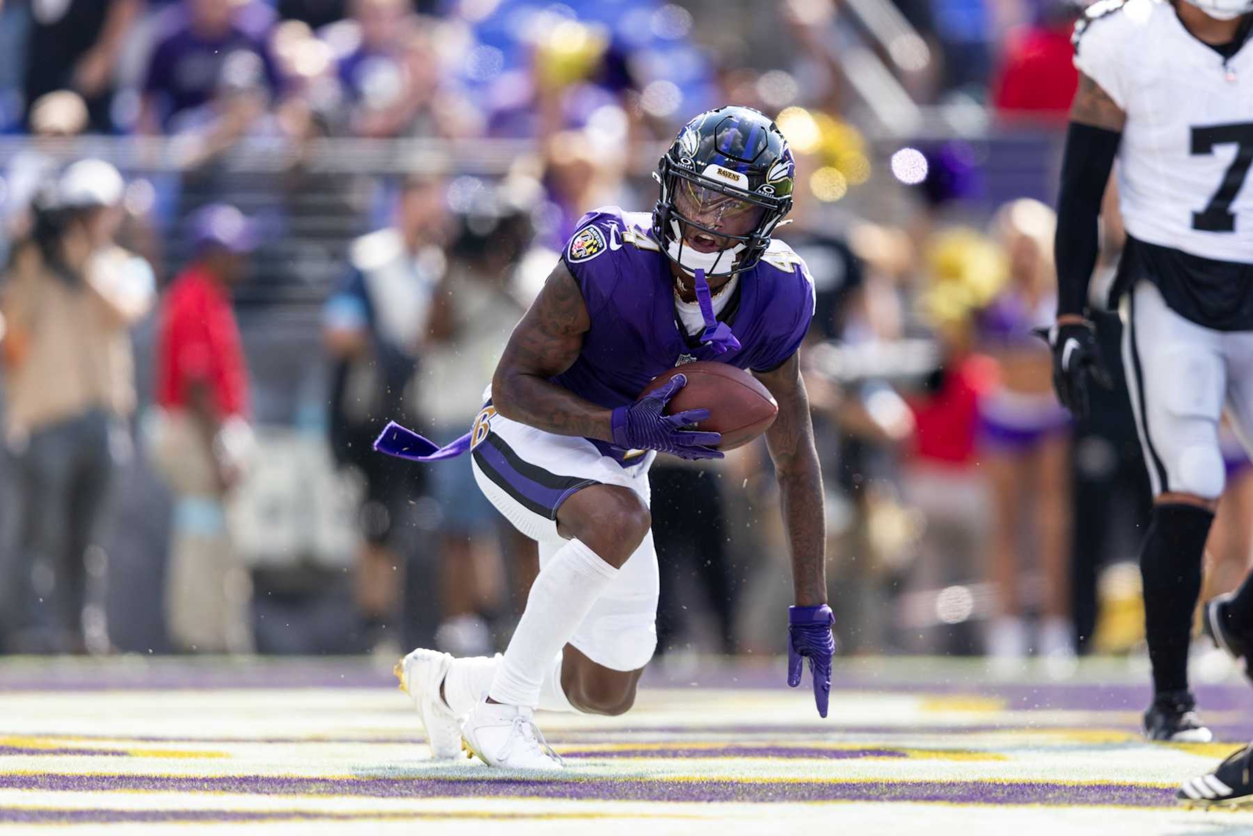 BALTIMORE, MARYLAND - SEPTEMBER 15: Zay Flowers #4 of the Baltimore Ravens reacts after scoring a touchdown against the Las Vegas Raiders during an NFL football game at M&T Bank Stadium on September 15, 2024 in Baltimore, Maryland. (Photo by Michael Owens/Getty Images)