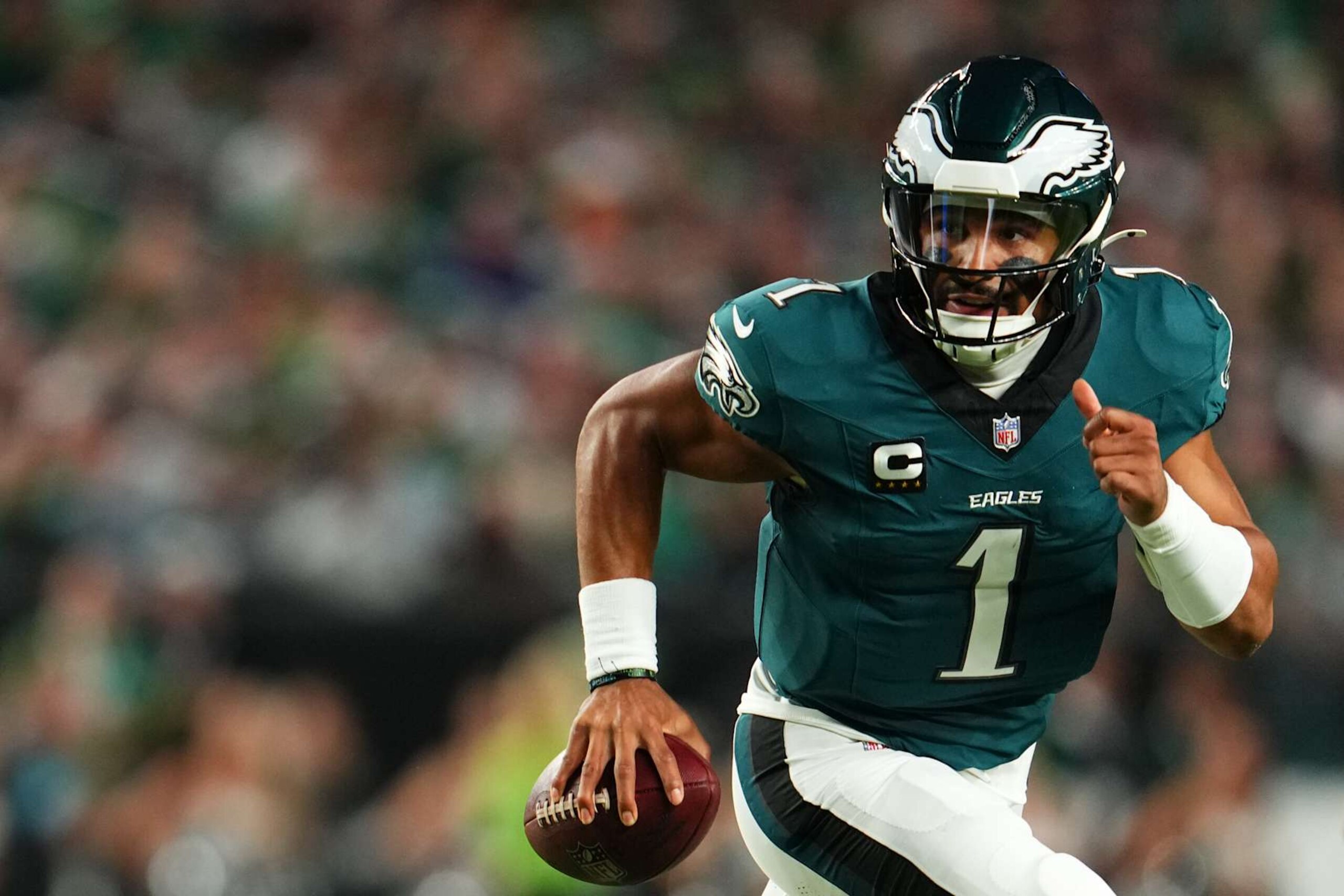 PHILADELPHIA, PA - SEPTEMBER 16: Jalen Hurts #1 of the Philadelphia Eagles scrambles against the Atlanta Falcons during the first half of a football game at Lincoln Financial Field on September 16, 2024 in Philadelphia, Pennsylvania. (Photo by Cooper Neill/Getty Images)