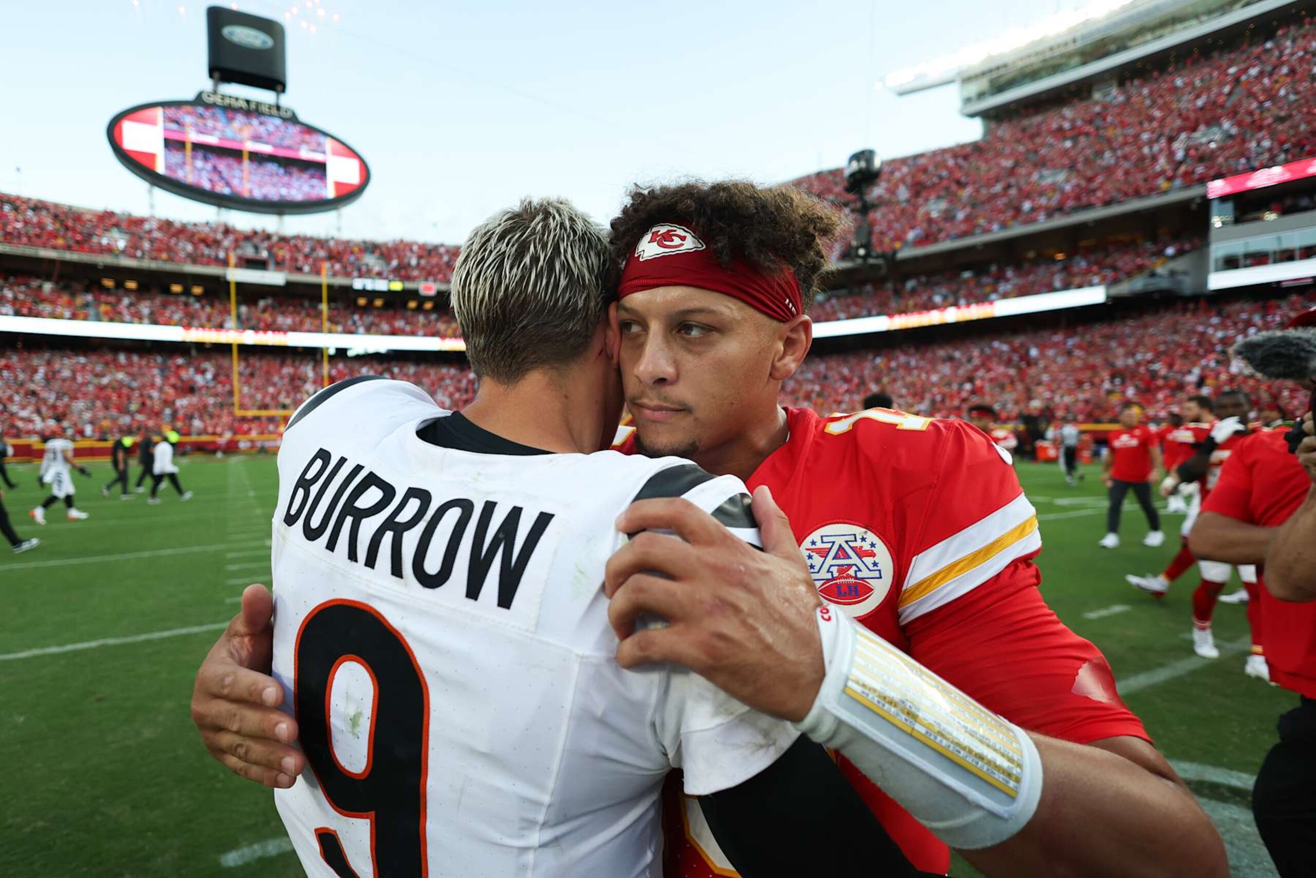 KANSAS CITY, MISSOURI - SEPTEMBER 15: Patrick Mahomes #15 of the Kansas City Chiefs hugs Joe Burrow #9 of the Cincinnati Bengals following the game at GEHA Field at Arrowhead Stadium on September 15, 2024 in Kansas City, Missouri. (Photo by Jamie Squire/Getty Images)
