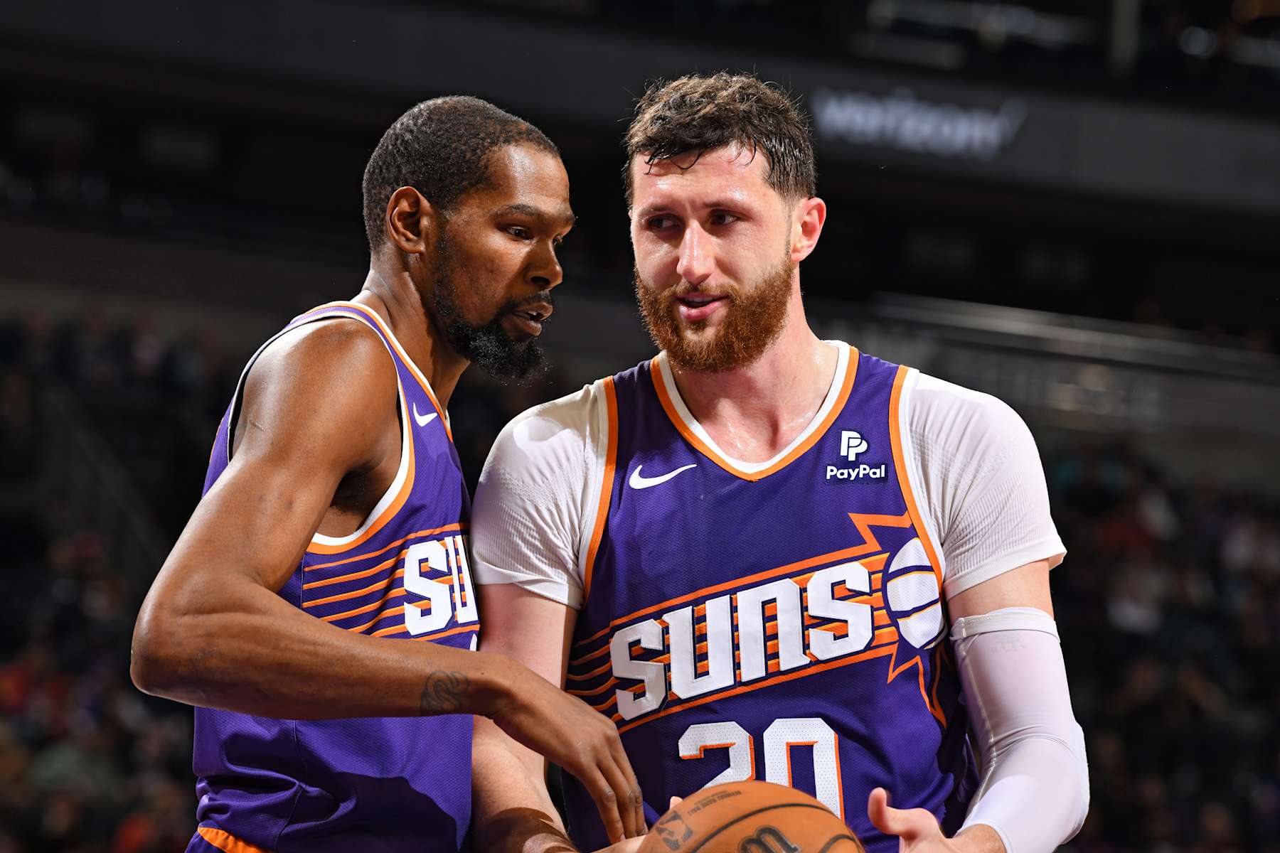 PHOENIX, AZ - FEBRUARY 14:  Jusuf Nurkic #20 and Kevin Durant #35 of the Phoenix Suns talk during the game against the Detroit Pistons on February 14, 2024 at Footprint Center in Phoenix, Arizona. NOTE TO USER: User expressly acknowledges and agrees that, by downloading and or using this photograph, user is consenting to the terms and conditions of the Getty Images License Agreement. Mandatory Copyright Notice: Copyright 2024 NBAE (Photo by Barry Gossage/NBAE via Getty Images)
