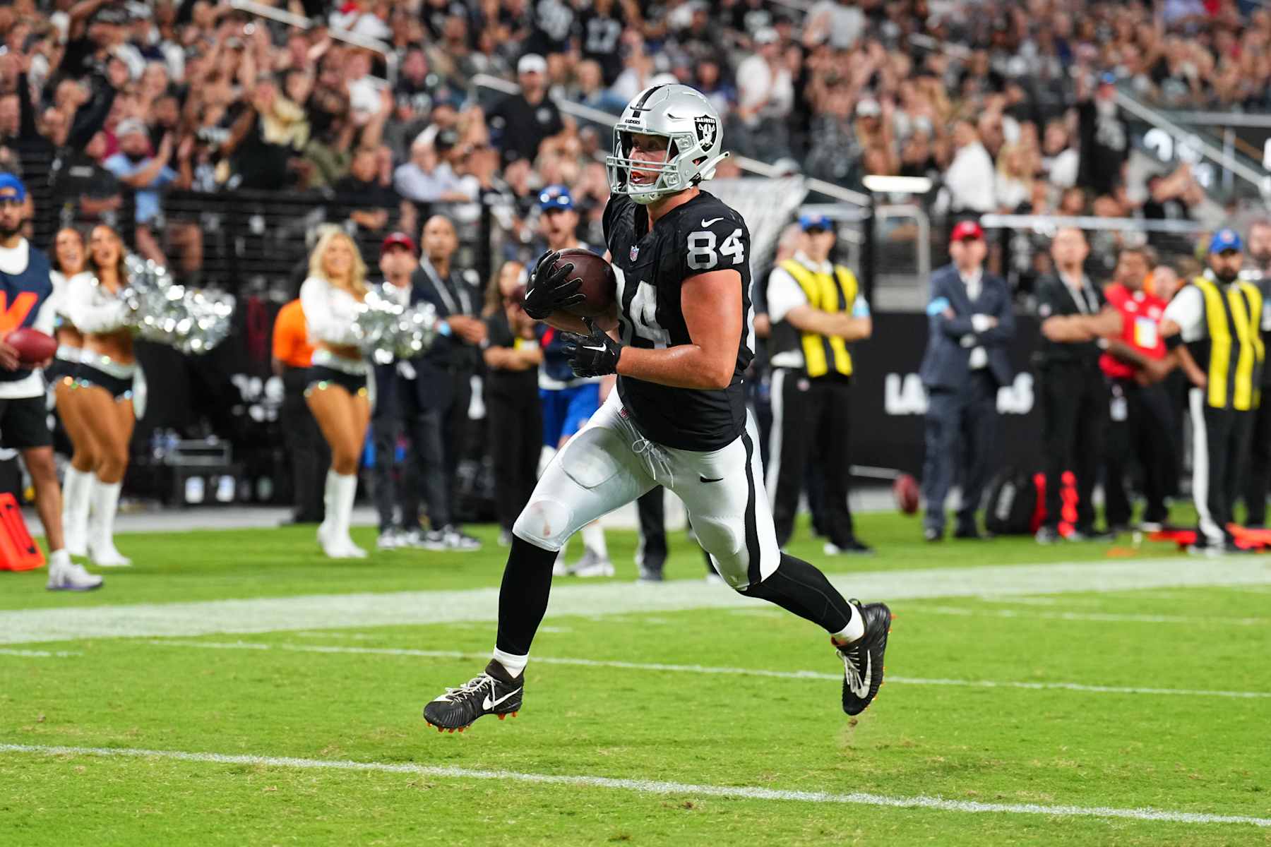 LAS VEGAS, NEVADA - AUGUST 17:  Tight end Harrison Bryant #84 of the Las Vegas Raiders catches a 5-yard touchdown pass during the second half of a preseason game against the Dallas Cowboys at Allegiant Stadium on August 17, 2024 in Las Vegas, Nevada.  (Photo by Chris Unger/Getty Images)
