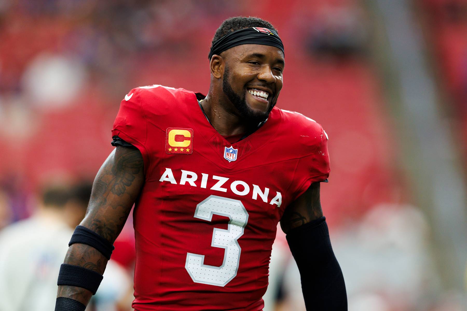 GLENDALE, ARIZONA - SEPTEMBER 15: Budda Baker #3 of the Arizona Cardinals smiles during a game against the Los Angeles Rams at State Farm Stadium on September 15, 2024 in Glendale, Arizona. (Photo by Ric Tapia/Getty Images)