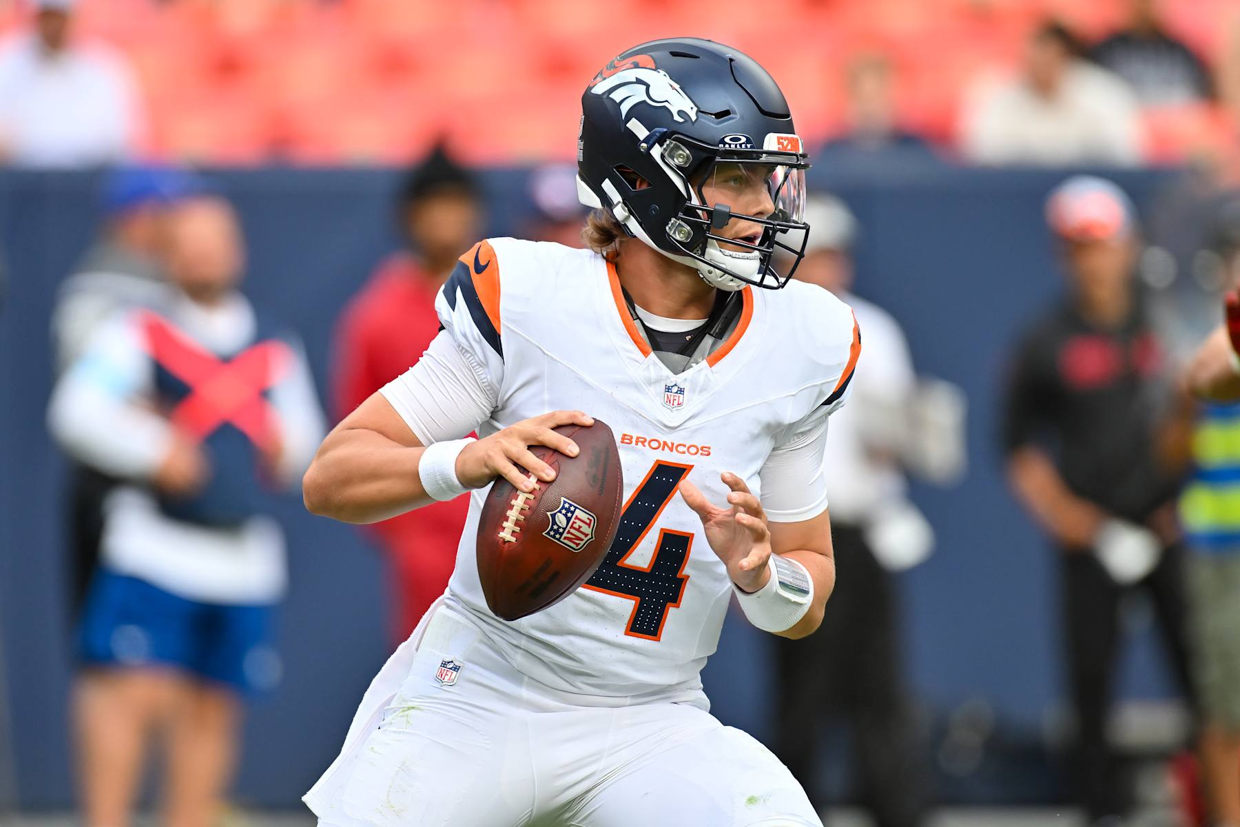 DENVER, CO - AUGUST 25: Denver Broncos quarterback Zach Wilson (4) in action during an NFL preseason game between the Denver Broncos and the Arizona Cardinals at Empower Field at Mile High Stadium in Denver, CO on August 25, 2024. (Photo by Kevin Langley/Icon Sportswire via Getty Images)