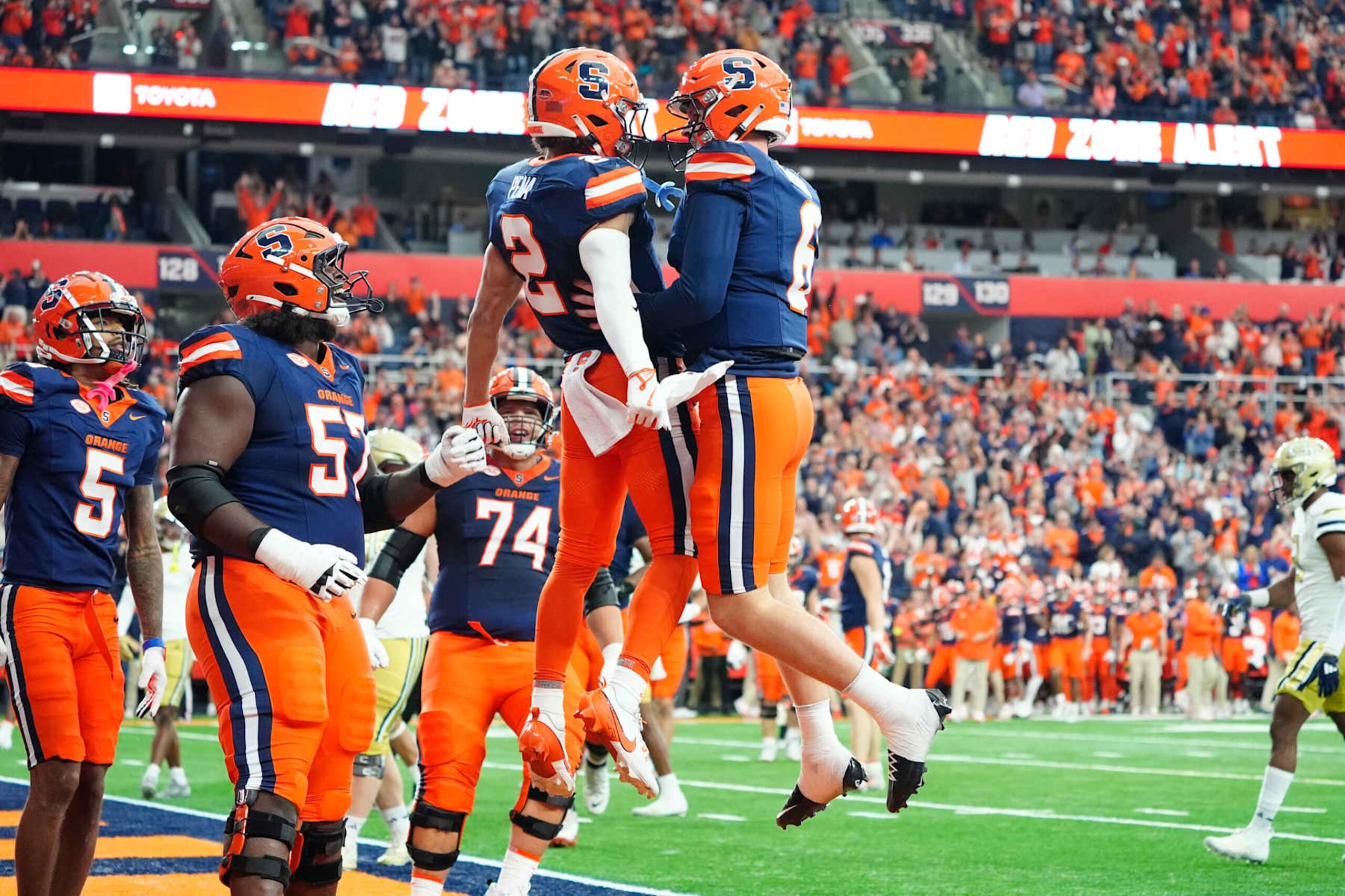 SYRACUSE, NY - SEPTEMBER 07: Syracuse Orange Wide Receiver Trebor Pena (2) and Syracuse Orange Quarterback Kyle McCord (6) celebrate scoring a touchdown during the first half between the Georgia Tech Yellow Jackets and the Syracuse Orange on September 7, 2024, at the JMA Wireless Dome in Syracuse, NY.  (Photo by Gregory Fisher/Icon Sportswire via Getty Images)