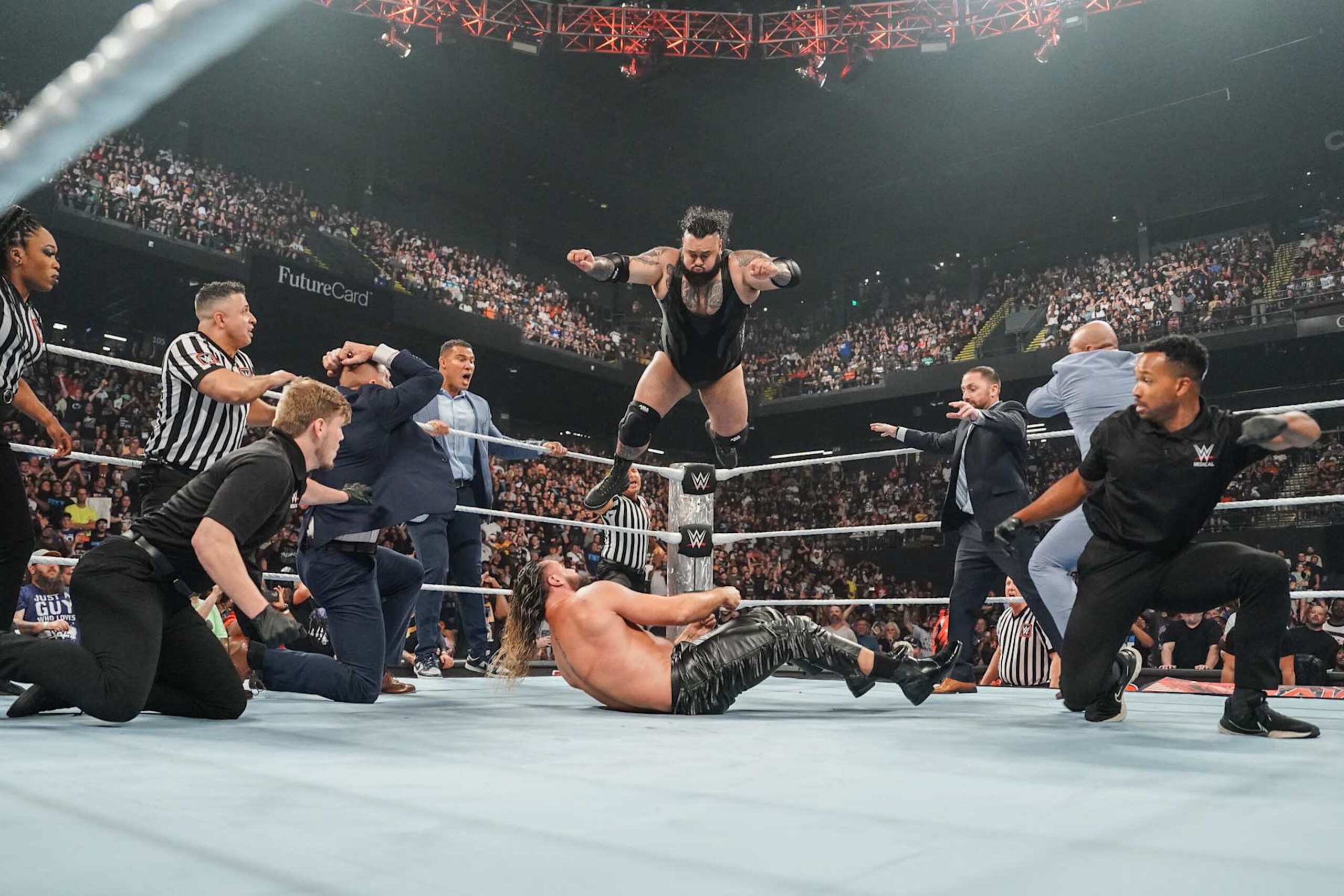 BALTIMORE, MARYLAND - AUGUST 5: Bronson Reed attacks Seth Rollins during Monday Night RAW at CFG Bank Arena on August 5, 2024 in Baltimore, Maryland.  (Photo by WWE/Getty Images)