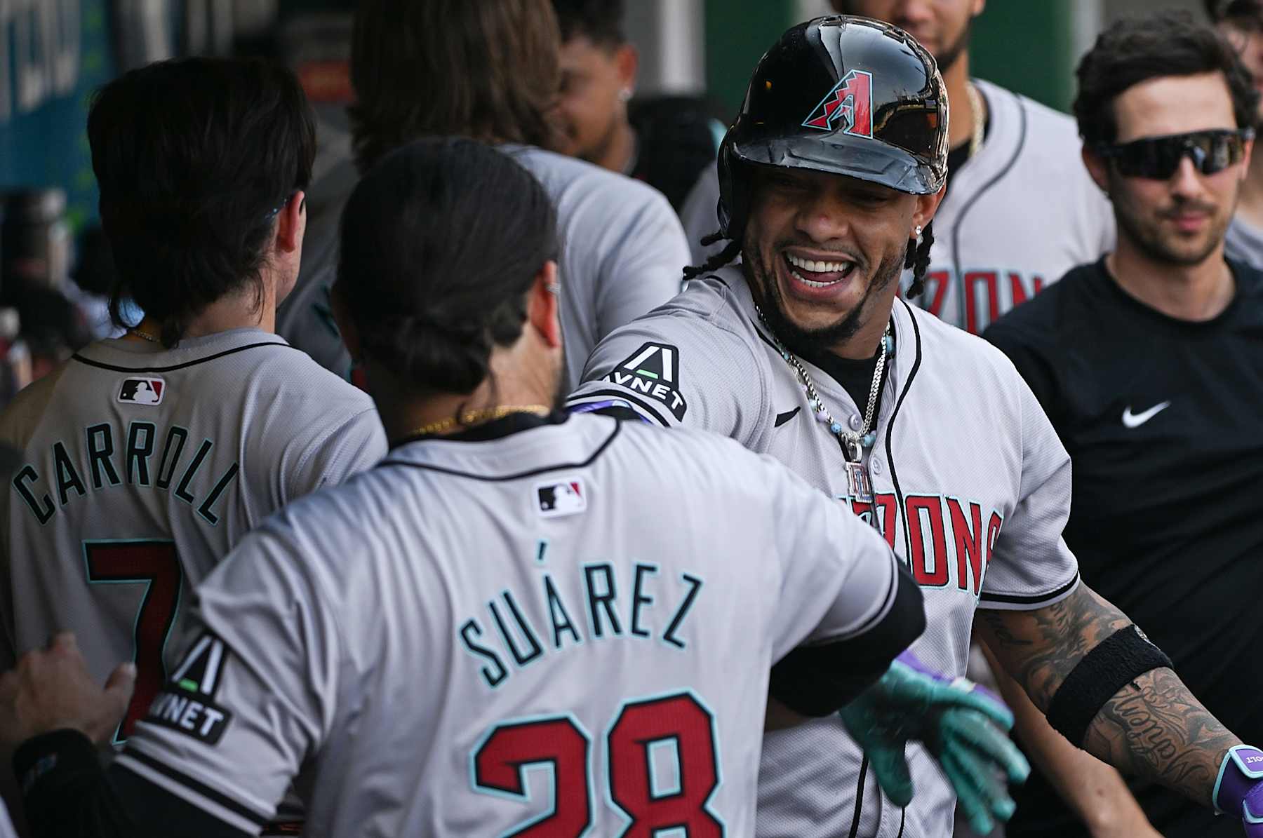 PITTSBURGH, PENNSYLVANIA - AUGUST 4: Ketel Marte #4 of the Arizona Diamondbacks celebrates in the dugout with Eugenio Suárez #28 after hitting a solo home run in the ninth inning during the game against the Pittsburgh Pirates at PNC Park on August 4, 2024 in Pittsburgh, Pennsylvania. (Photo by Justin Berl/Getty Images)