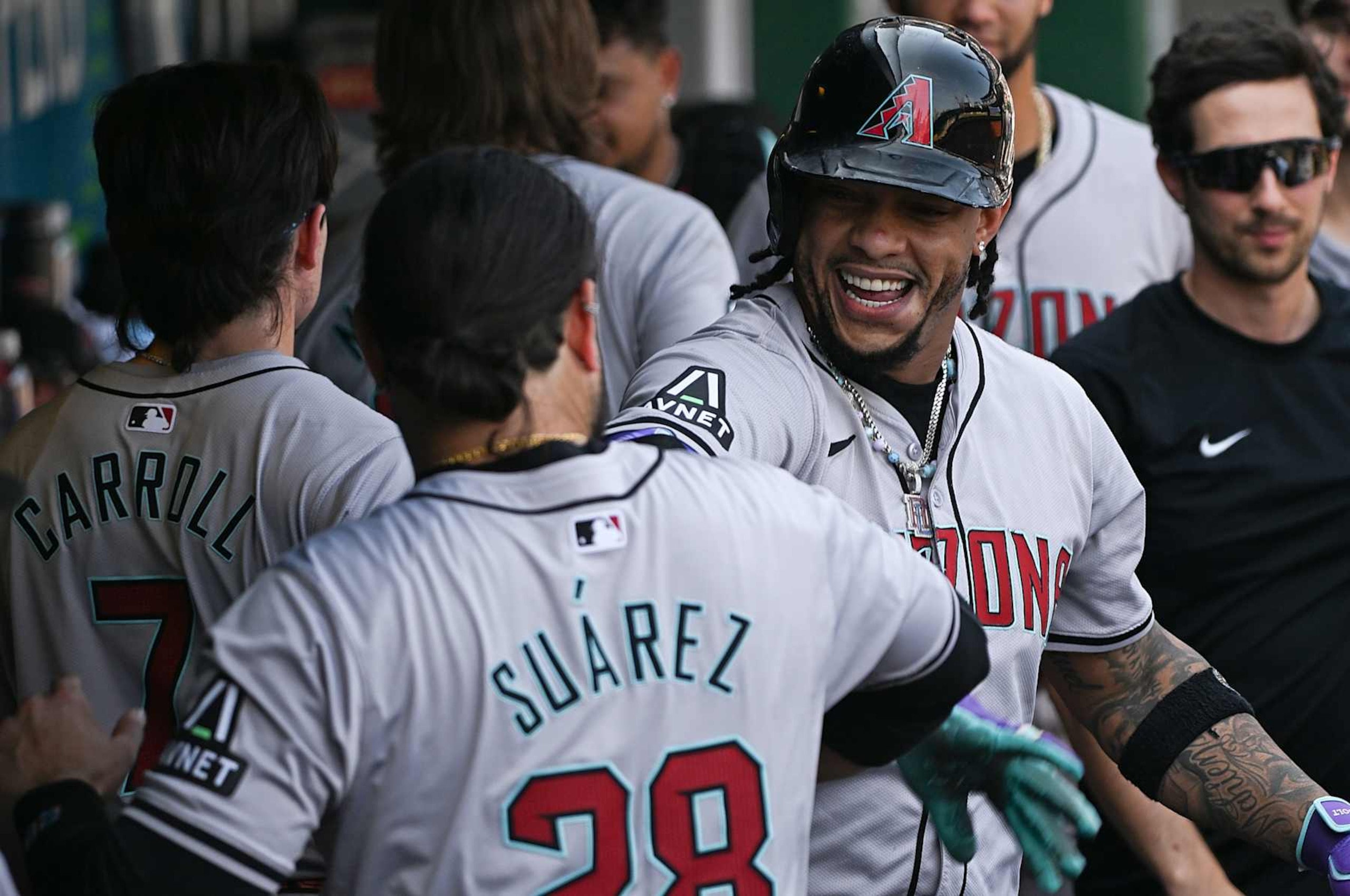 PITTSBURGH, PENNSYLVANIA - AUGUST 4: Ketel Marte #4 of the Arizona Diamondbacks celebrates in the dugout with Eugenio Suárez #28 after hitting a solo home run in the ninth inning during the game against the Pittsburgh Pirates at PNC Park on August 4, 2024 in Pittsburgh, Pennsylvania. (Photo by Justin Berl/Getty Images)