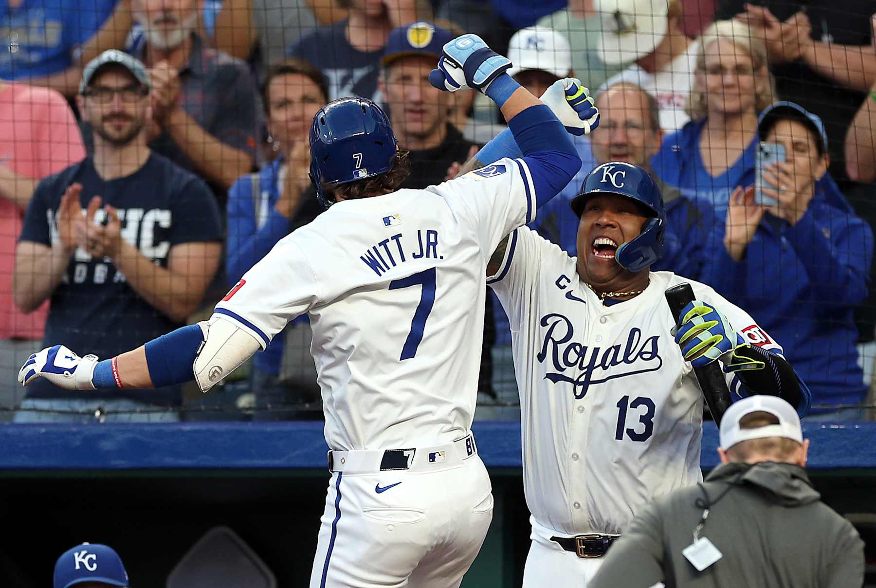 KANSAS CITY, MISSOURI - MAY 21:  Bobby Witt Jr. #7 of the Kansas City Royals is congratulated by Salvador Perez #13 after hitting a solo home run during the 6th inning of the game against the Detroit Tigers at Kauffman Stadium on May 21, 2024 in Kansas City, Missouri. (Photo by Jamie Squire/Getty Images)