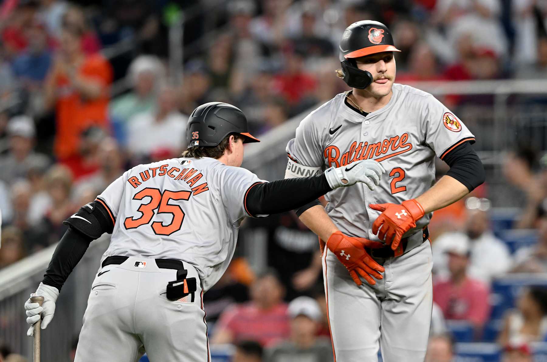 WASHINGTON, DC - MAY 08: Gunnar Henderson #2 of the Baltimore Orioles celebrates with Adley Rutschman #35 after hitting a home run in the sixth inning against the Washington Nationals at Nationals Park on May 08, 2024 in Washington, DC. (Photo by Greg Fiume/Getty Images)