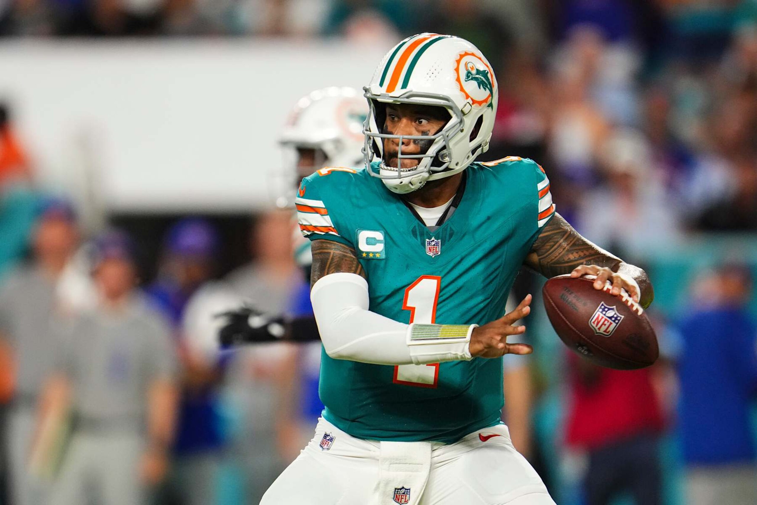 MIAMI GARDENS, FL - SEPTEMBER 12: Tua Tagovailoa #1 of the Miami Dolphins drops back to pass during an NFL football game against the Buffalo Bills at Hard Rock Stadium on September 12, 2024 in Miami Gardens, Florida. (Photo by Cooper Neill/Getty Images)