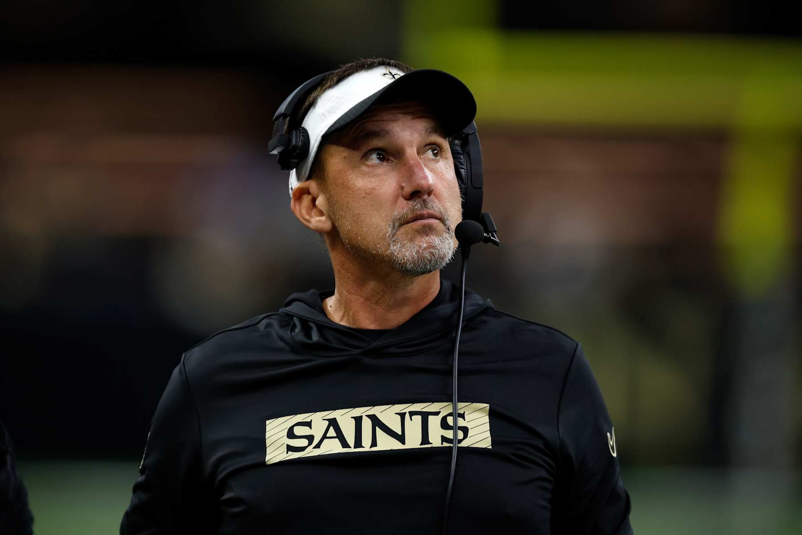 NEW ORLEANS, LOUISIANA - AUGUST 25: Head coach of the New Orleans Saints Dennis Allen looks on during the game against the Tennessee Titans  at Mercedes Benz Superdome on August 25, 2024 in New Orleans, Louisiana. (Photo by Chris Graythen/Getty Images)