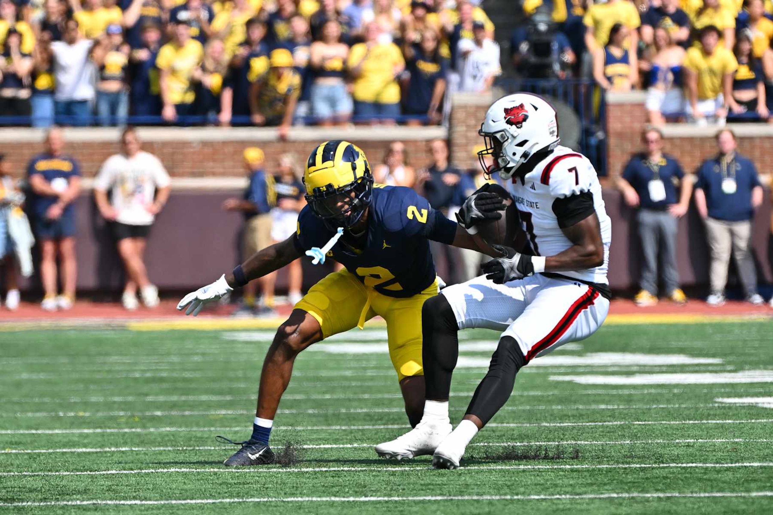 ANN ARBOR, MI - SEPTEMBER 14: Arkansas State Red Wolves wide receiver Corey Rucker (7) makes a catch in front of Michigan Wolverines defensive back Will Johnson (2) during the Michigan Wolverines versus the Arkansas State Red Wolves game on Saturday September 14, 2024 at Michigan Stadium in Ann Arbor, MI. (Photo by Steven King/Icon Sportswire via Getty Images) ANN ARBOR, MI - SEPTEMBER 14: Arkansas State Red Wolves wide receiver Corey Rucker (7) makes a catch in front of Michigan Wolverines defensive back Will Johnson (2) during the Michigan Wolverines versus the Arkansas State Red Wolves game on Saturday September 14, 2024 at Michigan Stadium in Ann Arbor, MI. (Photo by Steven King/Icon Sportswire via Getty Images)