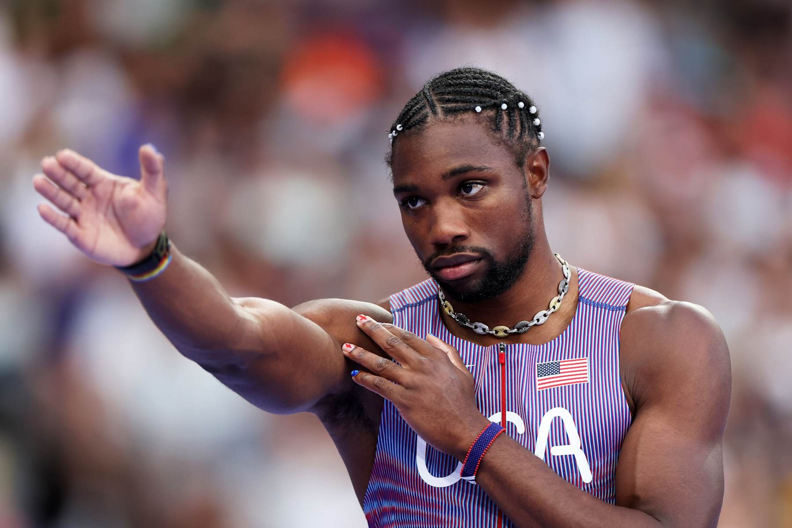 PARIS, FRANCE - AUGUST 07: Noah Lyles of Team United States reacts during in the Men's 200m Semi-Final on day twelve of the Olympic Games Paris 2024 at Stade de France on August 07, 2024 in Paris, France. (Photo by Cameron Spencer/Getty Images)