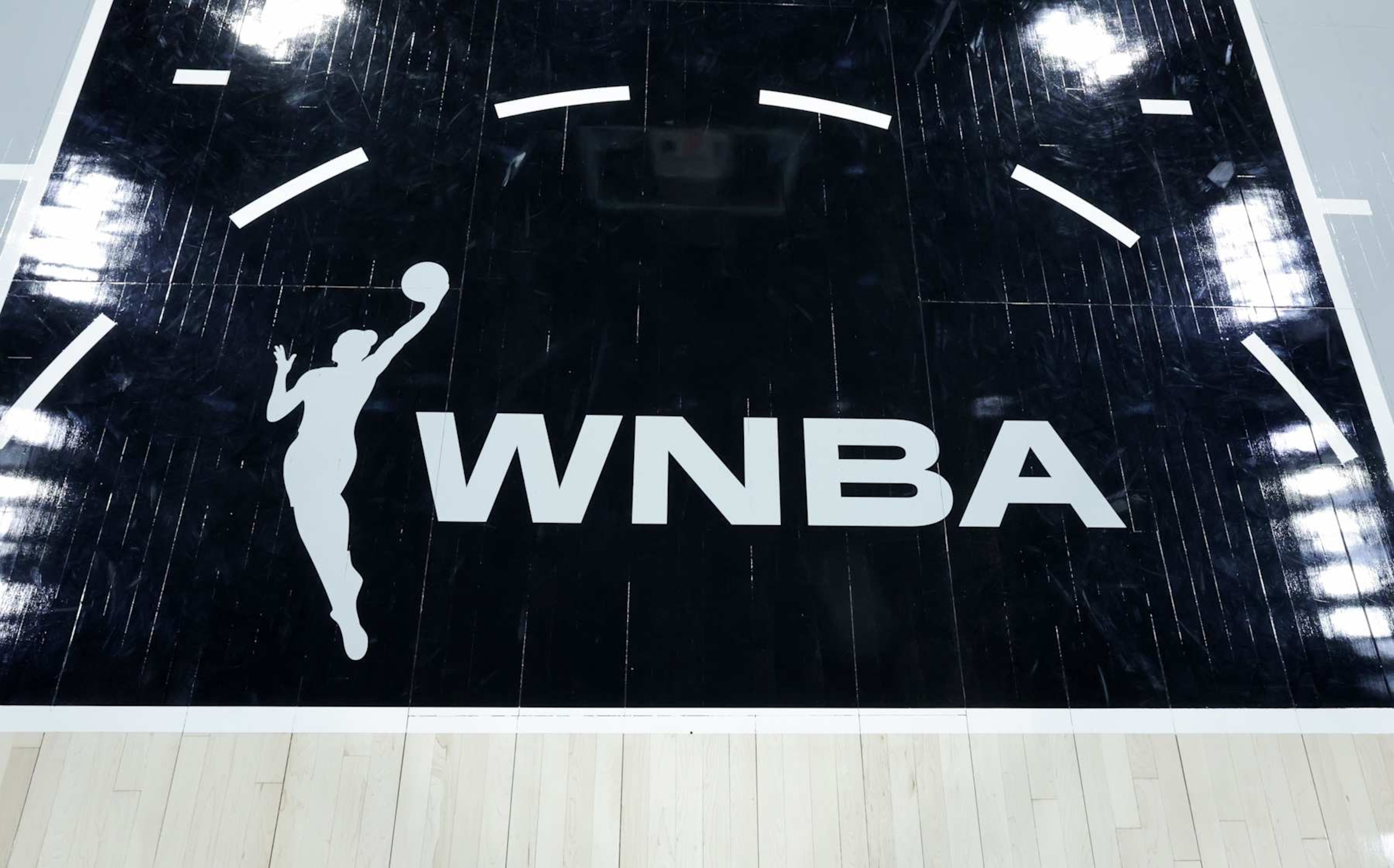 LAS VEGAS, NEVADA - MAY 18: A WNBA logo is shown on the court after the Las Vegas Aces' 89-82 victory over the Los Angeles Sparks at Michelob ULTRA Arena on May 18, 2024 in Las Vegas, Nevada. NOTE TO USER: User expressly acknowledges and agrees that, by downloading and or using this photograph, User is consenting to the terms and conditions of the Getty Images License Agreement. (Photo by Ethan Miller/Getty Images) LAS VEGAS, NEVADA - MAY 18: A WNBA logo is shown on the court after the Las Vegas Aces' 89-82 victory over the Los Angeles Sparks at Michelob ULTRA Arena on May 18, 2024 in Las Vegas, Nevada. NOTE TO USER: User expressly acknowledges and agrees that, by downloading and or using this photograph, User is consenting to the terms and conditions of the Getty Images License Agreement. (Photo by Ethan Miller/Getty Images)