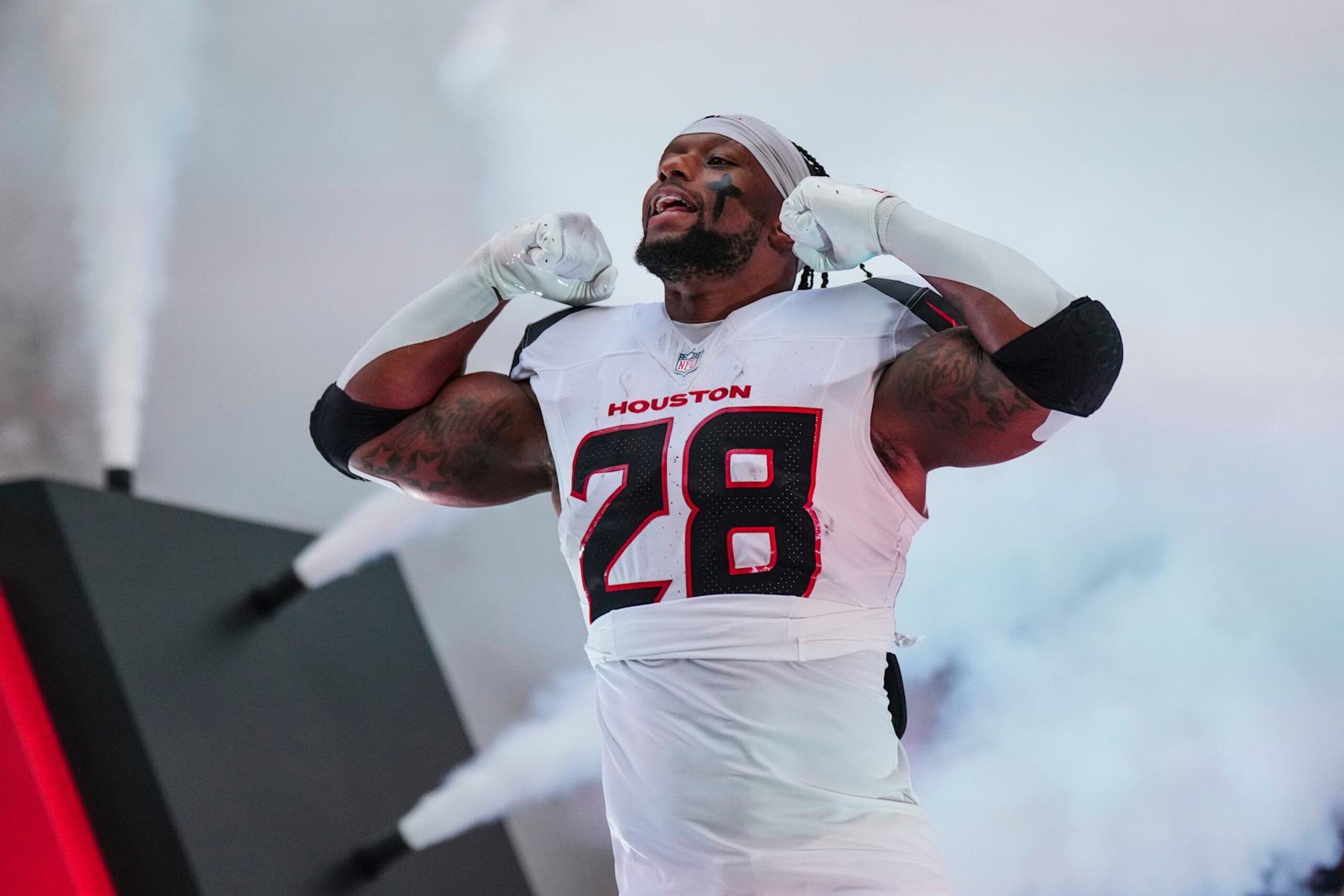 HOUSTON, TX - SEPTEMBER 15: Joe Mixon #28 of the Houston Texans runs out of the tunnel prior to an NFL football game against the Chicago Bears during a football game at NRG Stadium on September 15, 2024 in Houston, Texas. (Photo by Cooper Neill/Getty Images) HOUSTON, TX - SEPTEMBER 15: Joe Mixon #28 of the Houston Texans runs out of the tunnel prior to an NFL football game against the Chicago Bears during a football game at NRG Stadium on September 15, 2024 in Houston, Texas. (Photo by Cooper Neill/Getty Images)