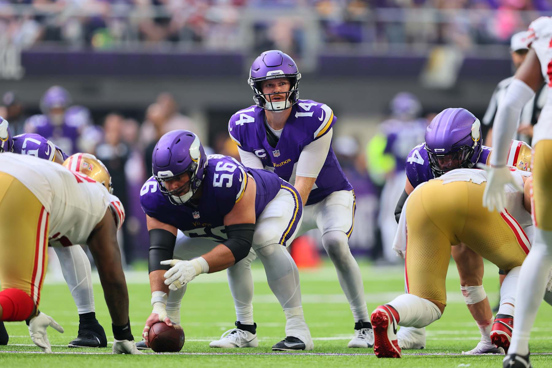 MINNEAPOLIS, MINNESOTA - SEPTEMBER 15: Quarterback Sam Darnold #14 of the Minnesota Vikings takes the snap against the San Francisco 49ers during the third quarter at U.S. Bank Stadium on September 15, 2024 in Minneapolis, Minnesota. (Photo by Adam Bettcher/Getty Images)