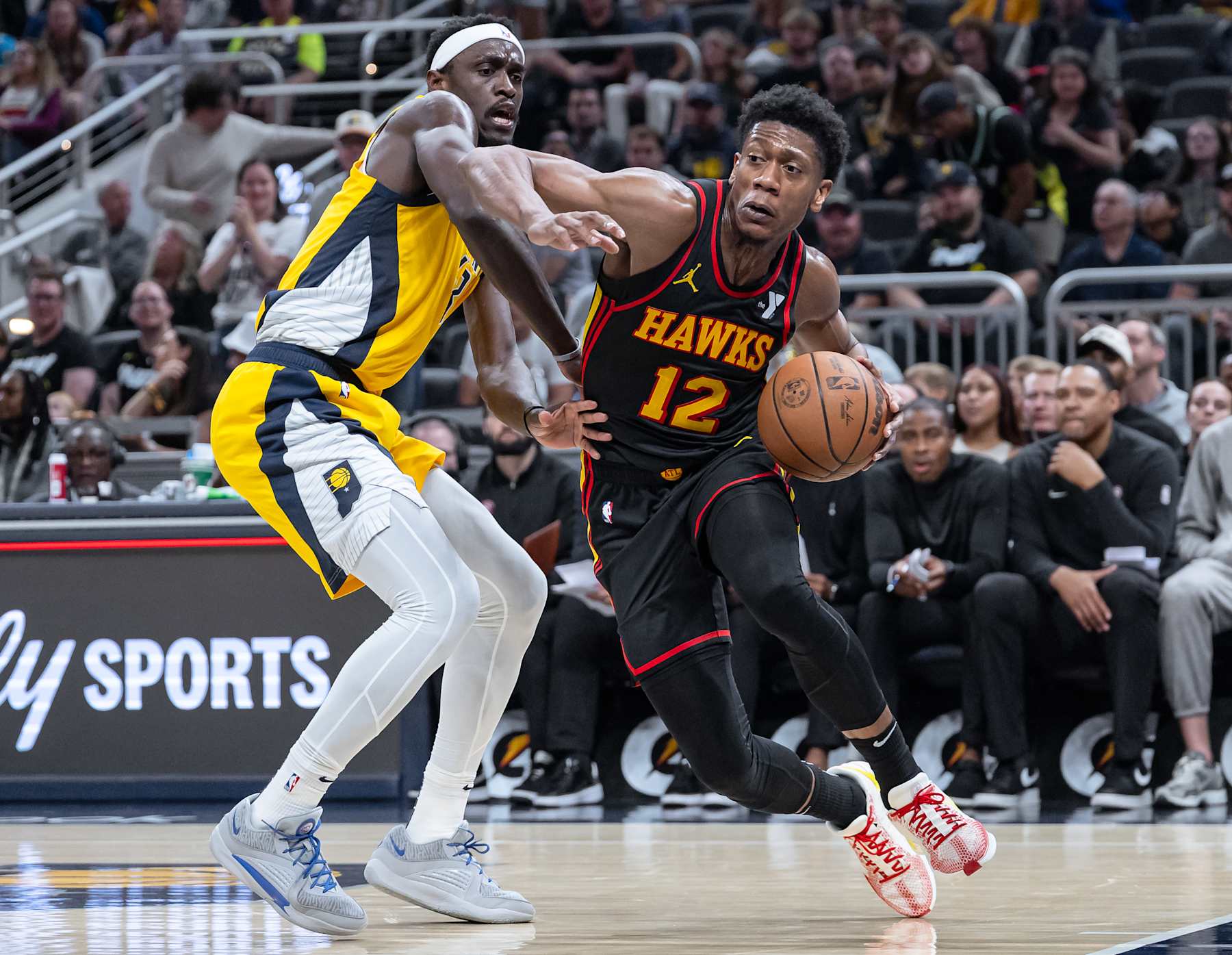 INDIANAPOLIS, INDIANA - APRIL 14: De'Andre Hunter #12 of the Atlanta Hawks drives to the basket against Pascal Siakam #43 of the Indiana Pacers at Gainbridge Fieldhouse on April 14, 2024 in Indianapolis, Indiana. NOTE TO USER: User expressly acknowledges and agrees that, by downloading and or using this photograph, User is consenting to the terms and conditions of the Getty Images License Agreement. (Photo by Michael Hickey/Getty Images)