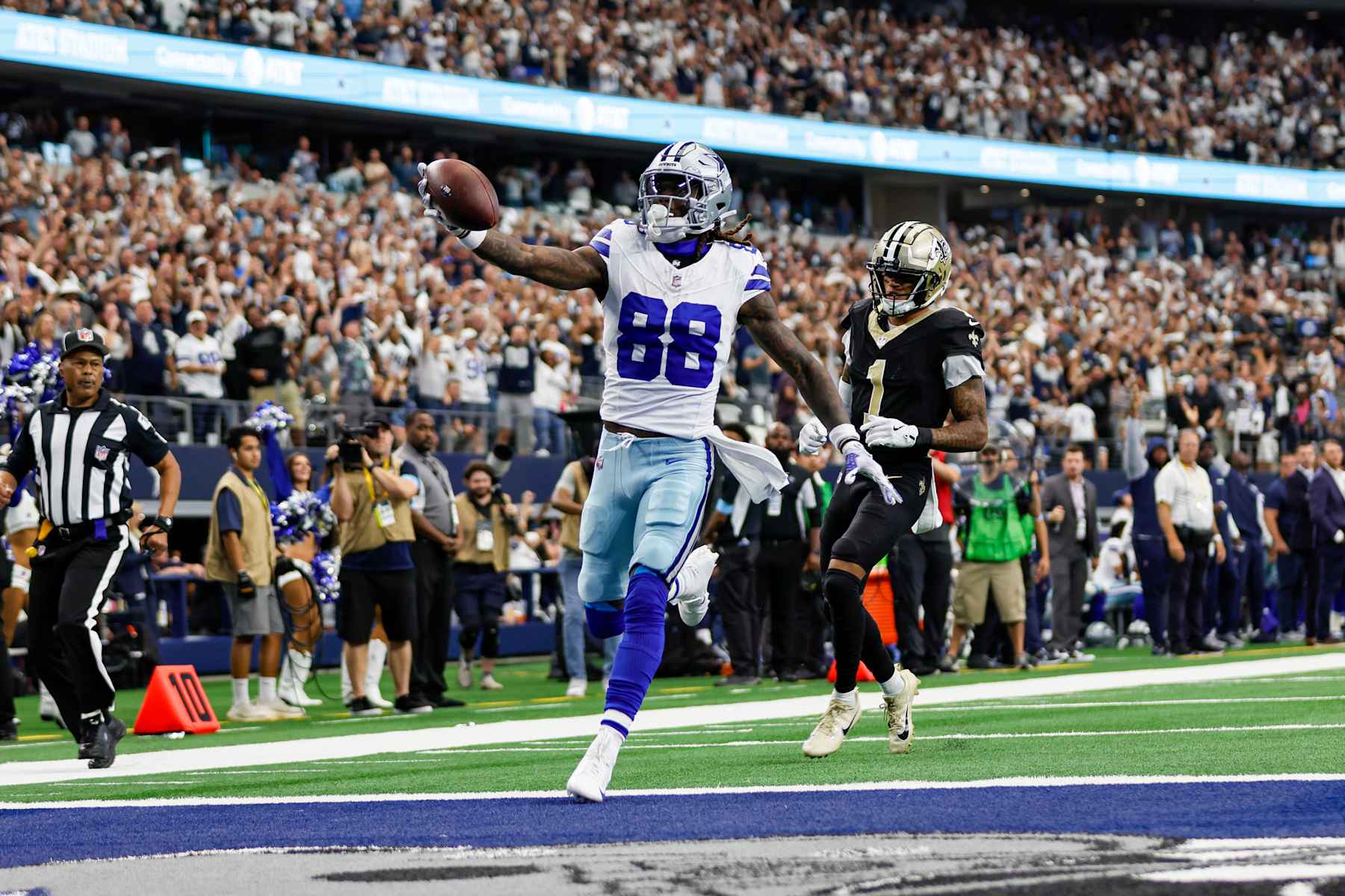 ARLINGTON, TX - SEPTEMBER 15: Dallas Cowboys wide receiver CeeDee Lamb (88) scores a touchdown during the game between the Dallas Cowboys and the New Orleans Saints on September 15, 2024 at AT&T Stadium in Arlington, Texas. (Photo by Matthew Pearce/Icon Sportswire via Getty Images)