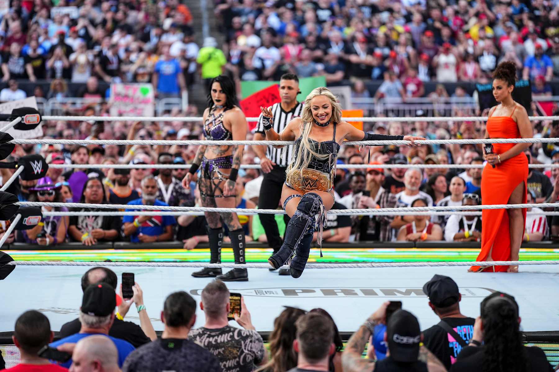 CLEVELAND, OHIO - AUGUST 3: Liv Morgan enters the ring as Rhea Ripley looks on during SummerSlam at Cleveland Browns Stadium on August 3, 2024 in Cleveland, Ohio.  (Photo by WWE/Getty Images)